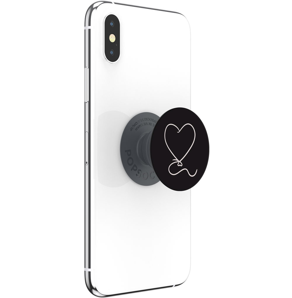 Ein weißes Smartphone mit einem schwarzen PopSocket mit einer weißen Umrandung eines herzförmigen Ballons.