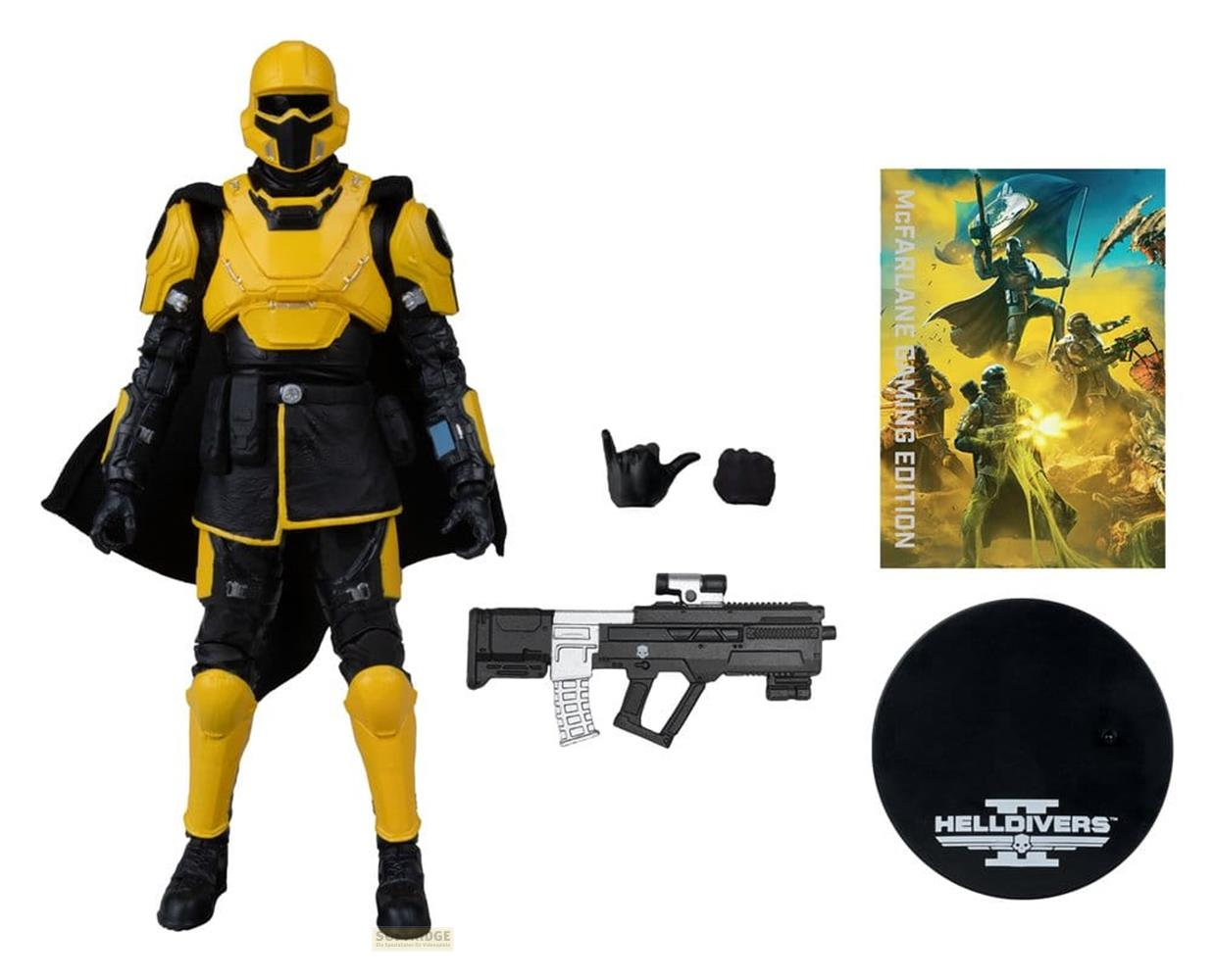 Action figure di Helldivers gialla e nera con arma, mani, base e cartolina artistica su sfondo bianco.