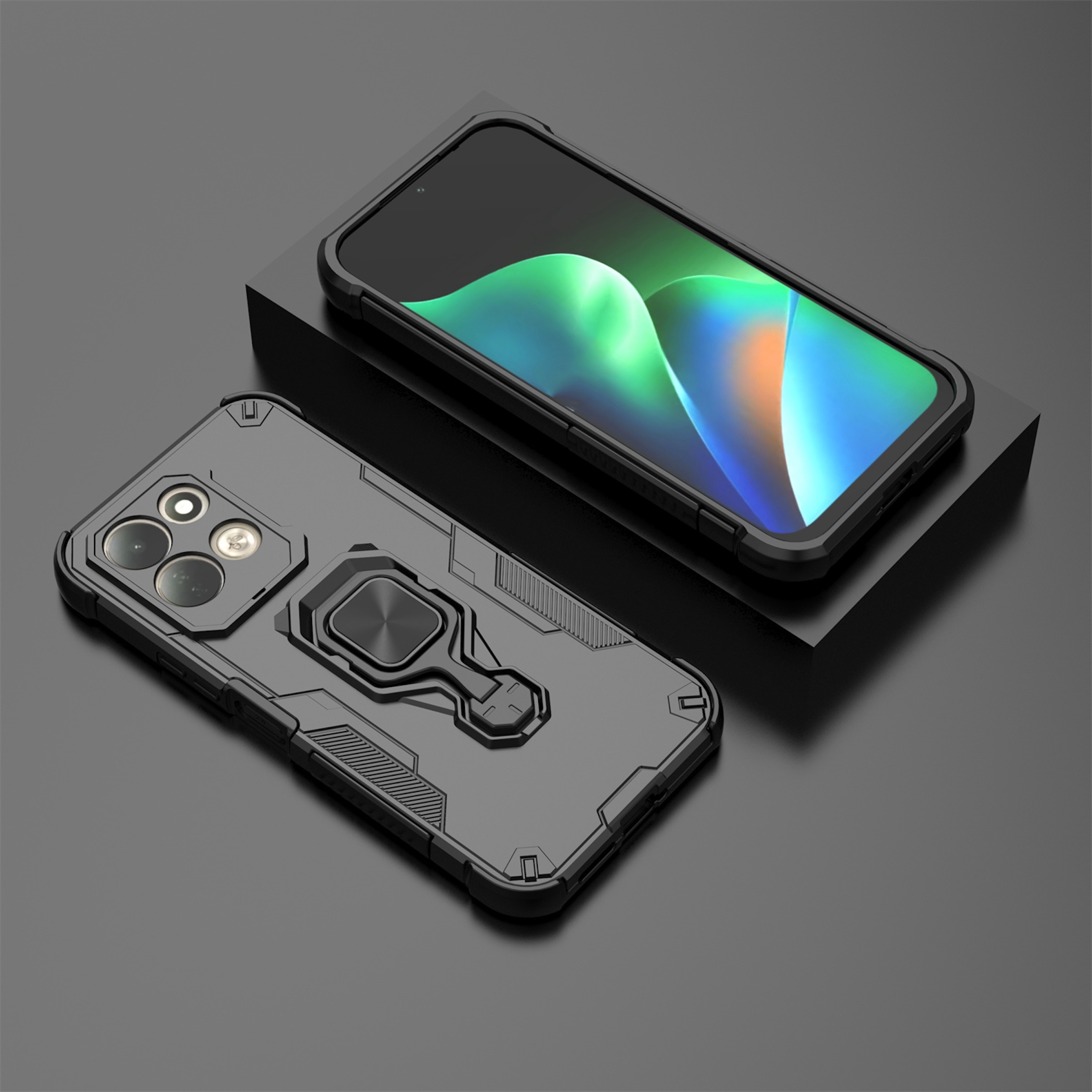 Ein schwarzes Smartphone mit Schutzhülle und Ringhalterung liegt neben einer weiteren Hülle.