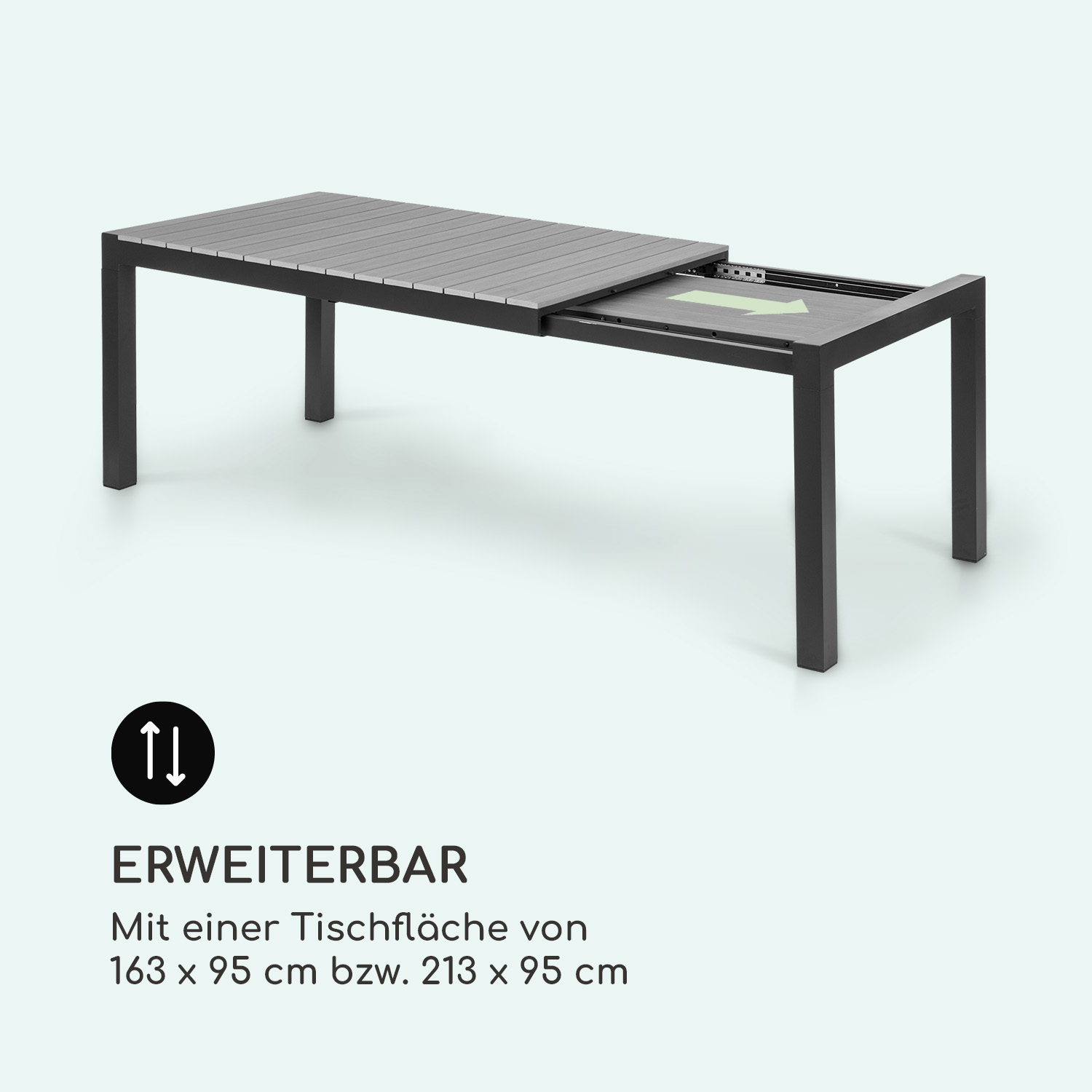 Ein ausziehbarer grauer Tisch mit schwarzem Metallgestell auf hellgrauem Hintergrund.