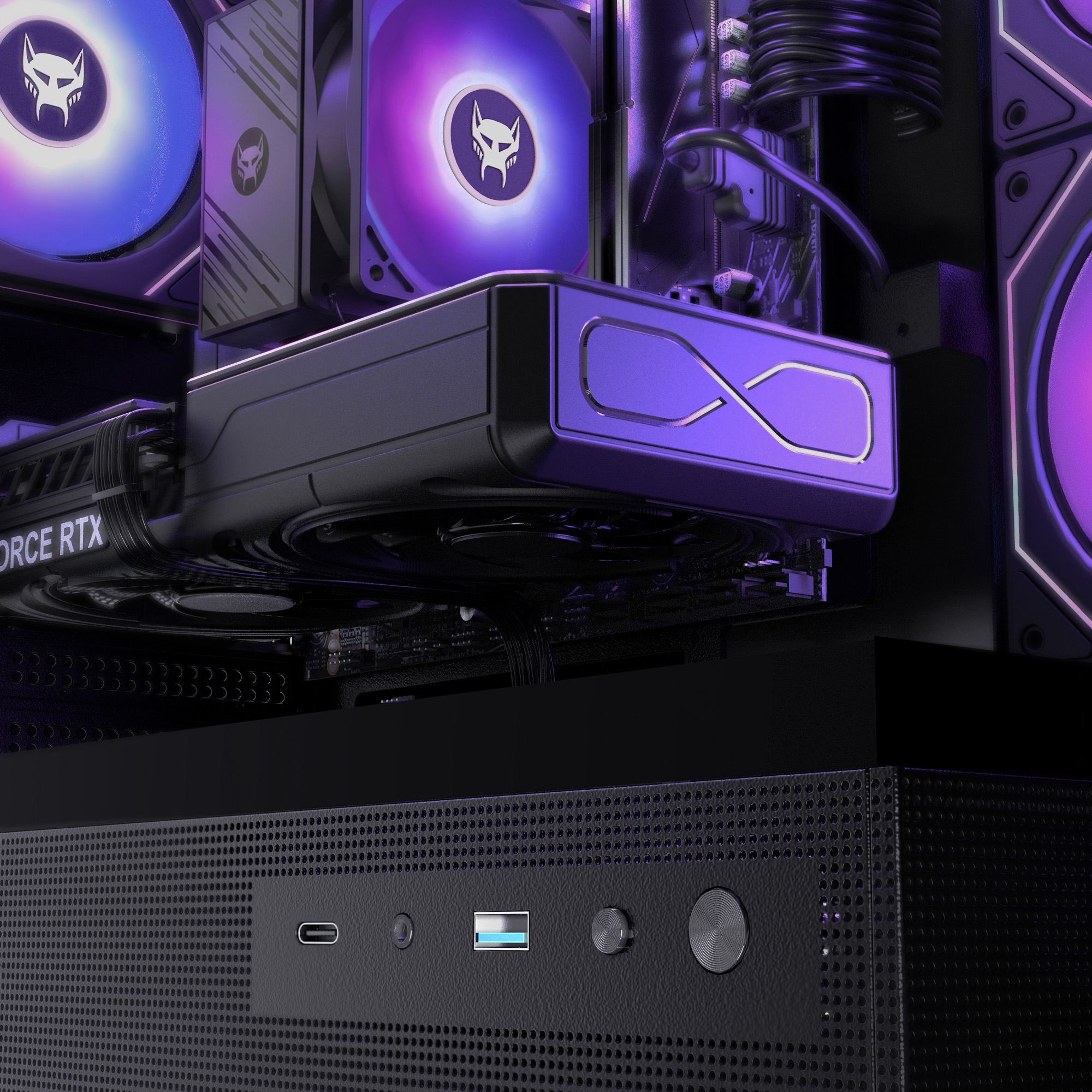 Vista interna di un PC da gioco con ventole RGB blu e viola e una scheda grafica.