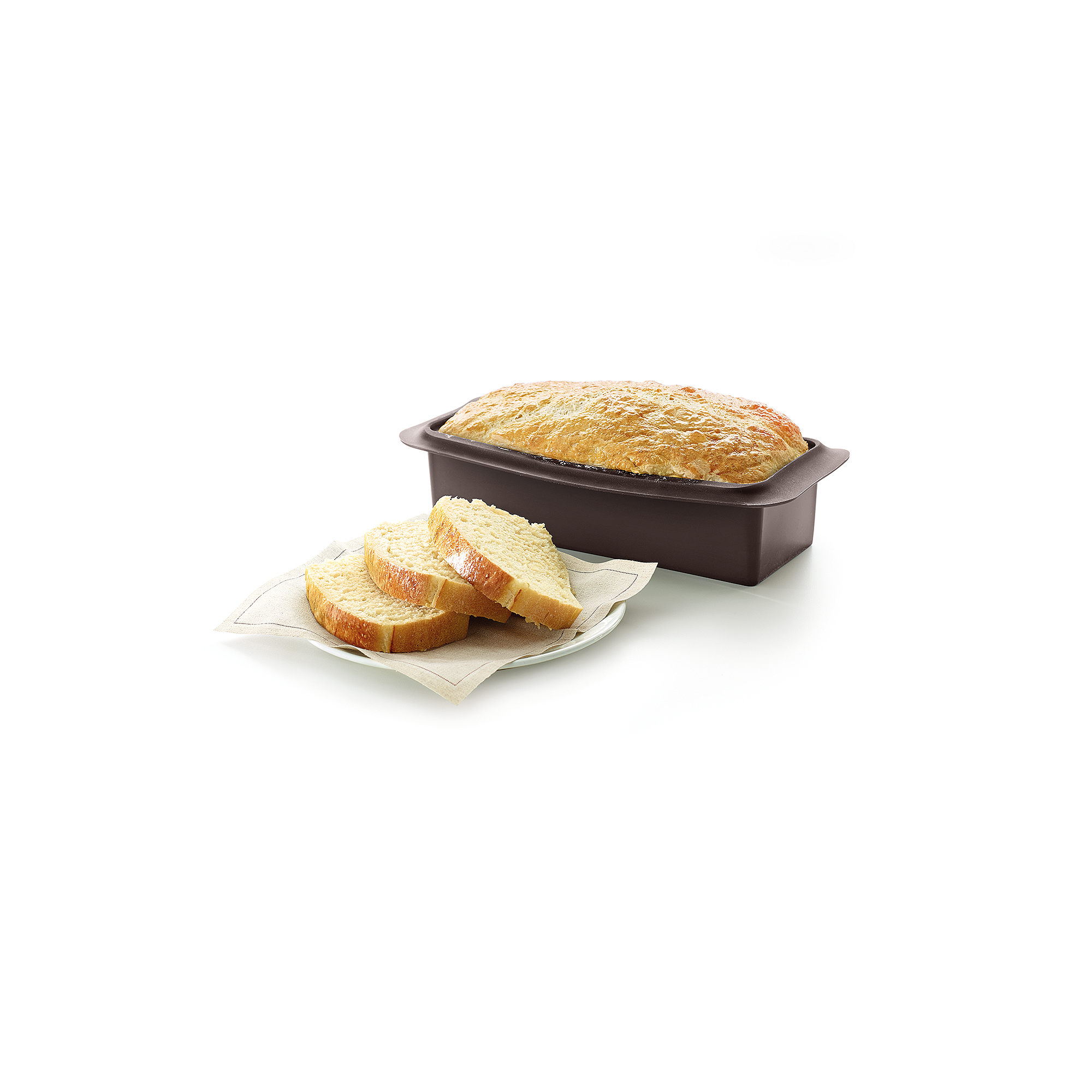 A golden loaf of bread in a brown silicone pan, with three sliced pieces on a napkin.