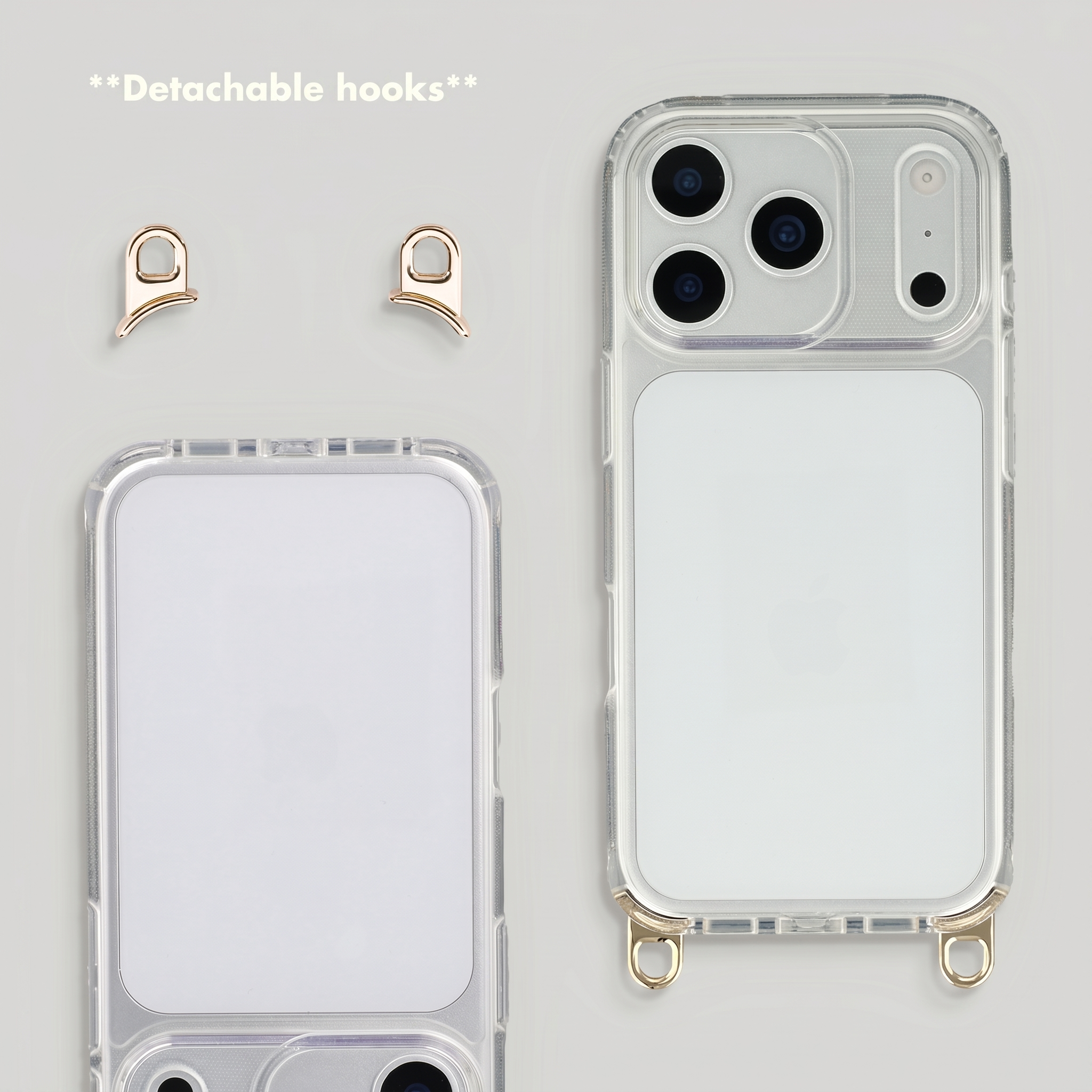 Transparente Handyhülle mit zwei abnehmbaren goldenen Haken auf hellem Hintergrund.