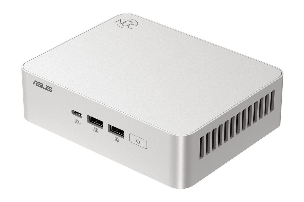 Un mini PC ASUS NUC plateado con puertos USB y botón de encendido en el panel frontal, visto desde arriba.