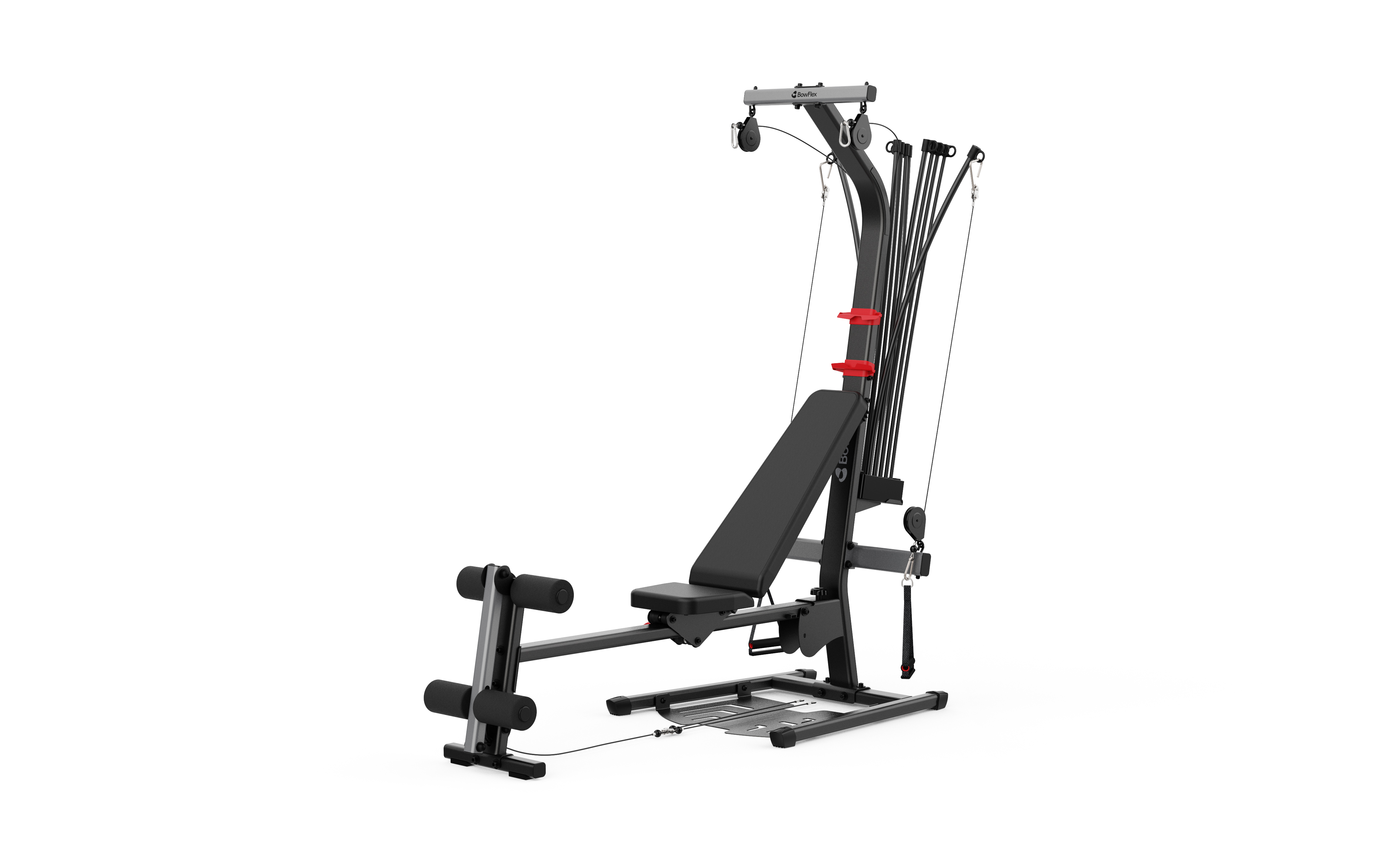 Ein schwarzes Bowflex Krafttrainingsgerät mit verstellbarer Bank, Rollen und Kabelzügen vor weißem Hintergrund.