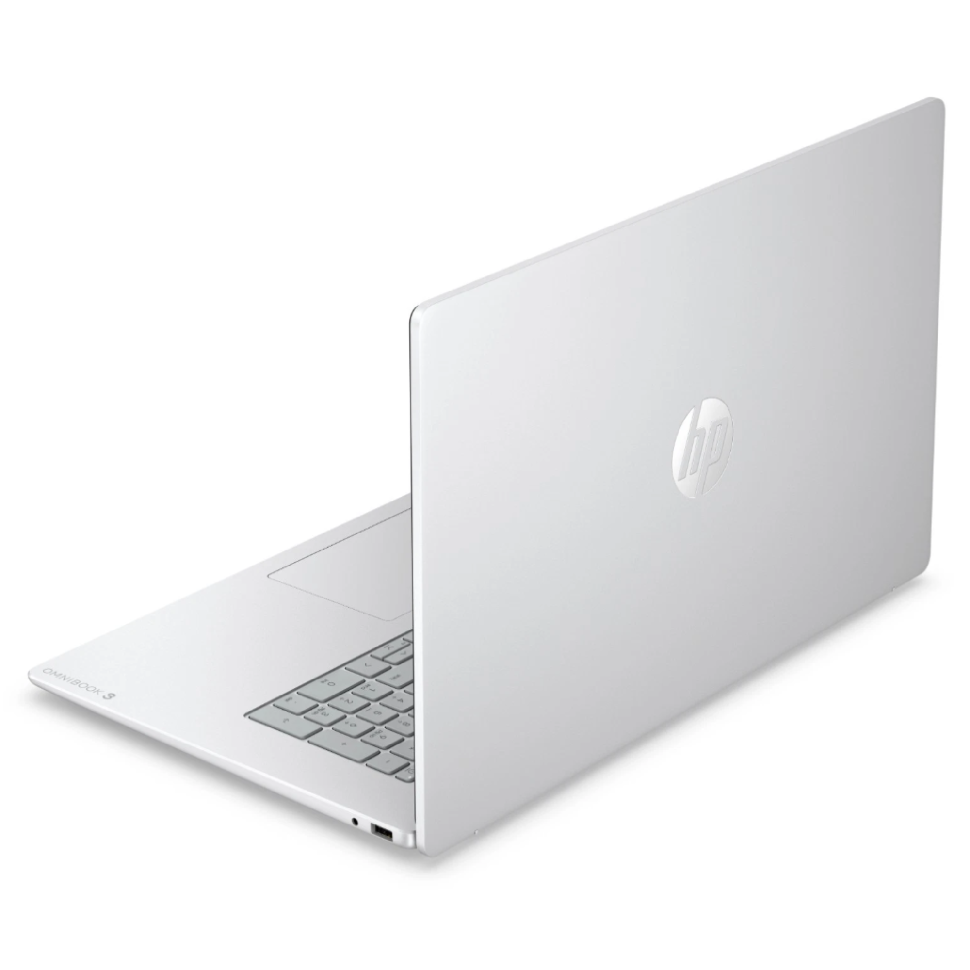 Ein silberner HP Omnibook 3 Laptop steht auf einer weißen Oberfläche, die Ansicht zeigt die geschlossene Rückseite.