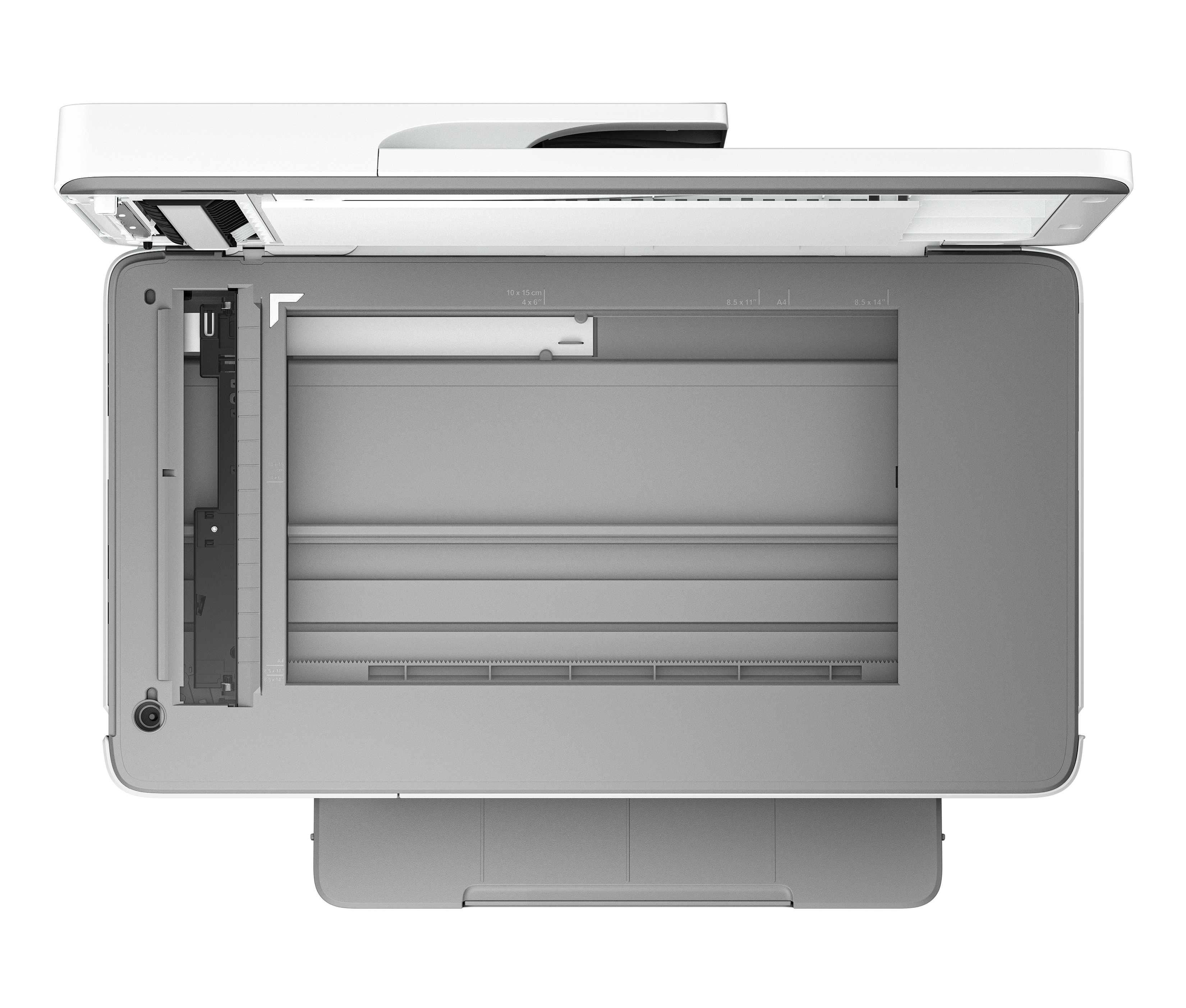 Top-down-Ansicht eines offenen Scanners mit grauer Glasplatte und Papiereinzug.