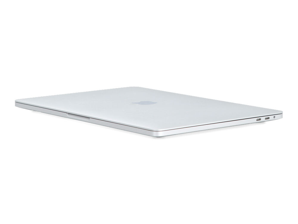 Zamknięty srebrny laptop pokazany z boku na białym tle.