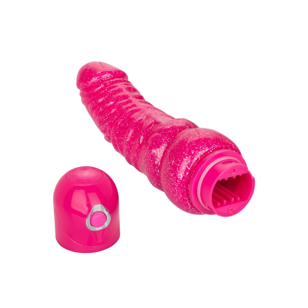 Ein glitzernd-pinker, gerippter Dildo mit abnehmbarer Kappe auf weißem Hintergrund.