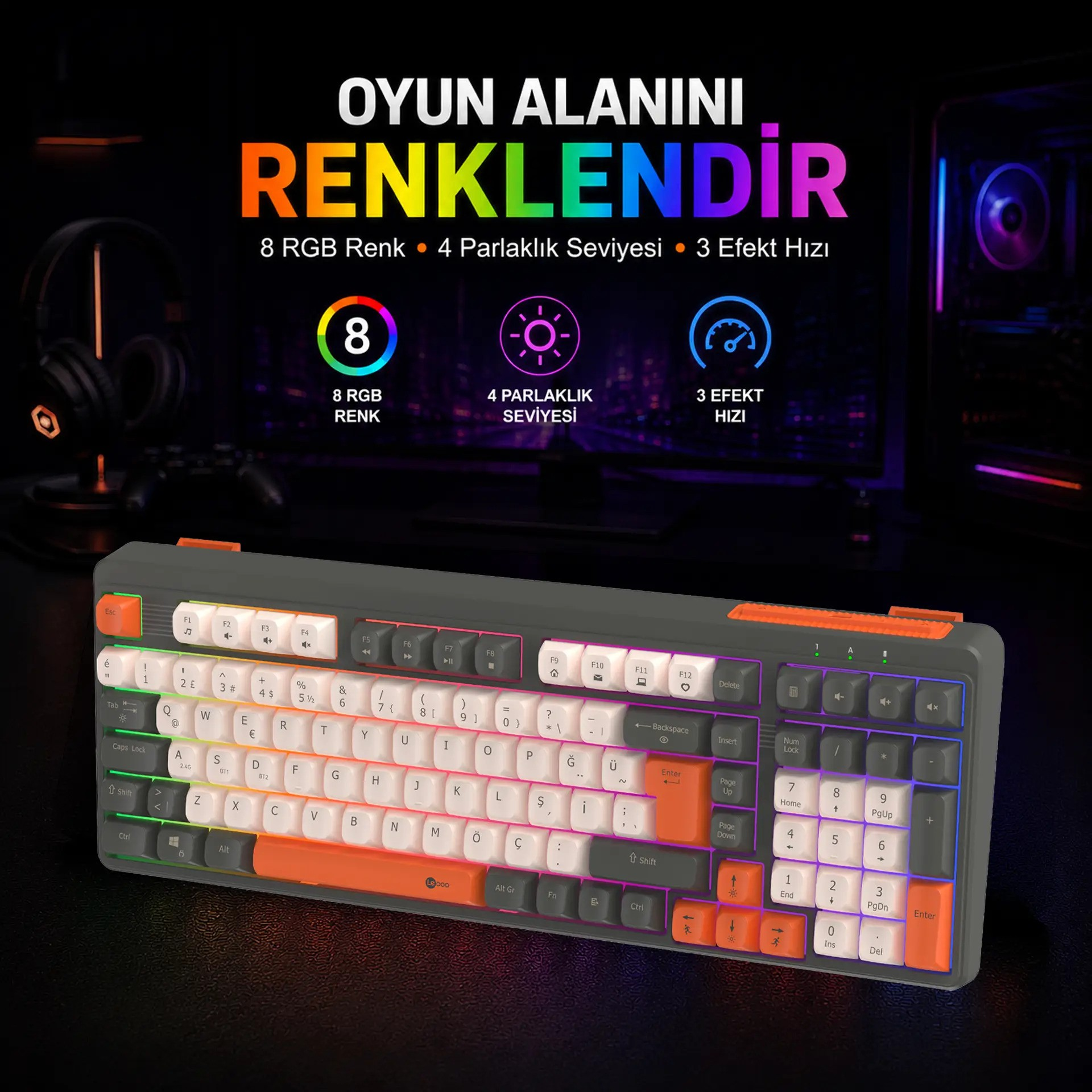 Bir monitörün önünde turuncu detaylara ve renkli RGB arka aydınlatmaya sahip gri bir oyuncu klavyesi.
