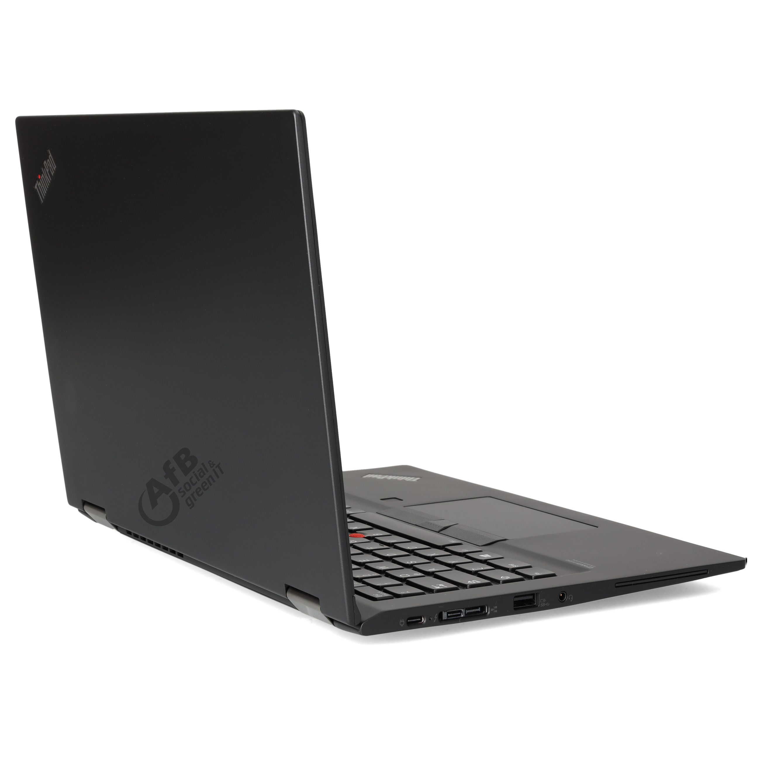 Ein geschlossener schwarzer Laptop auf einer weißen Oberfläche, seitlich gesehen mit sichtbaren Anschlüssen und Logo.