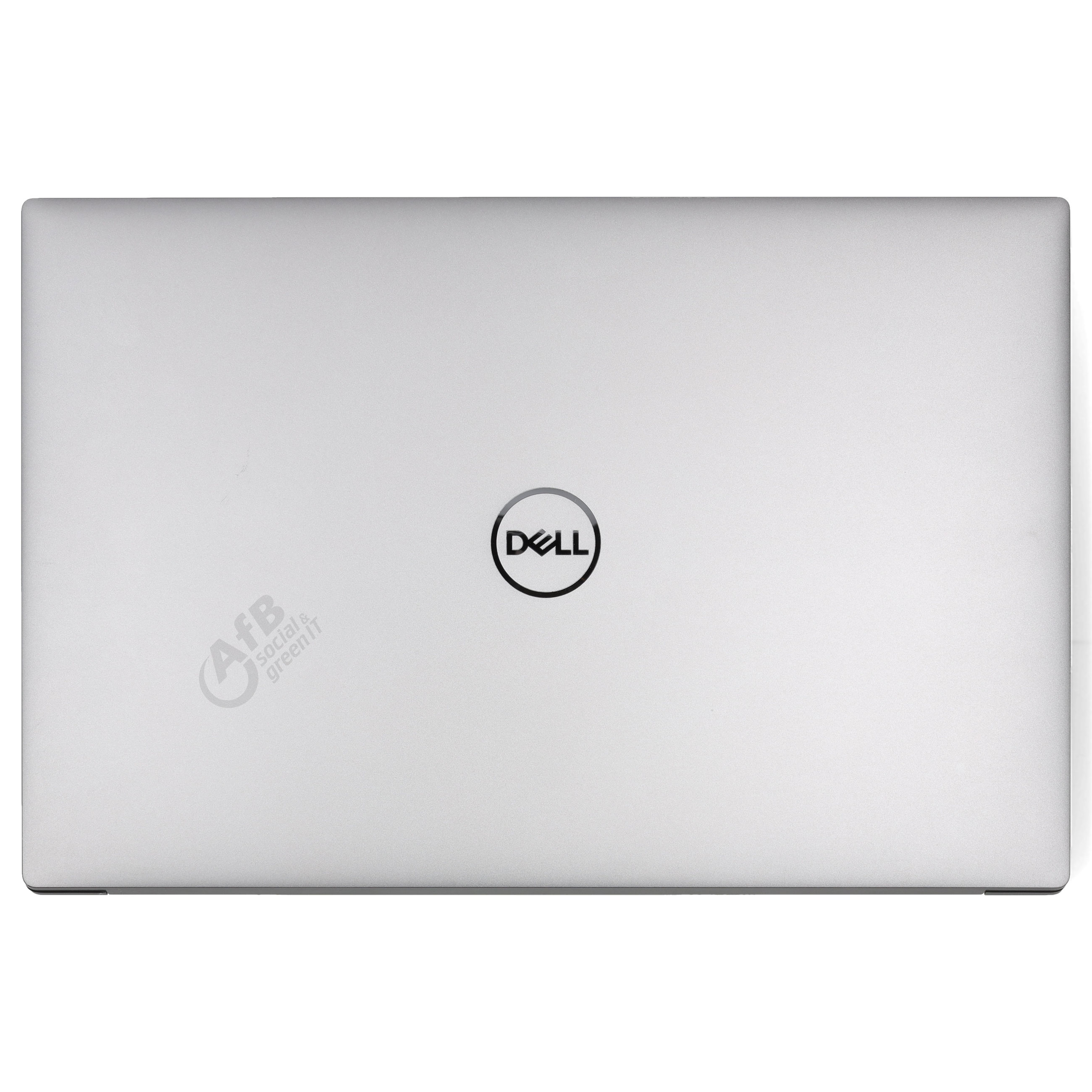 Geschlossener silberner Dell-Laptop mit Firmenlogo und Aufkleber auf der Vorderseite vor weißem Hintergrund.