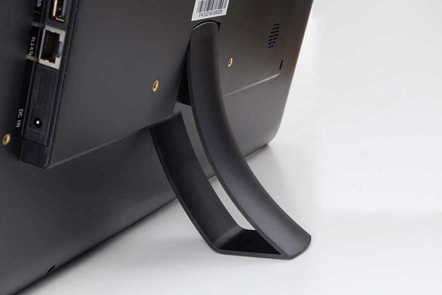 Vista posteriore di un monitor nero con supporto curvo e porte visibili.