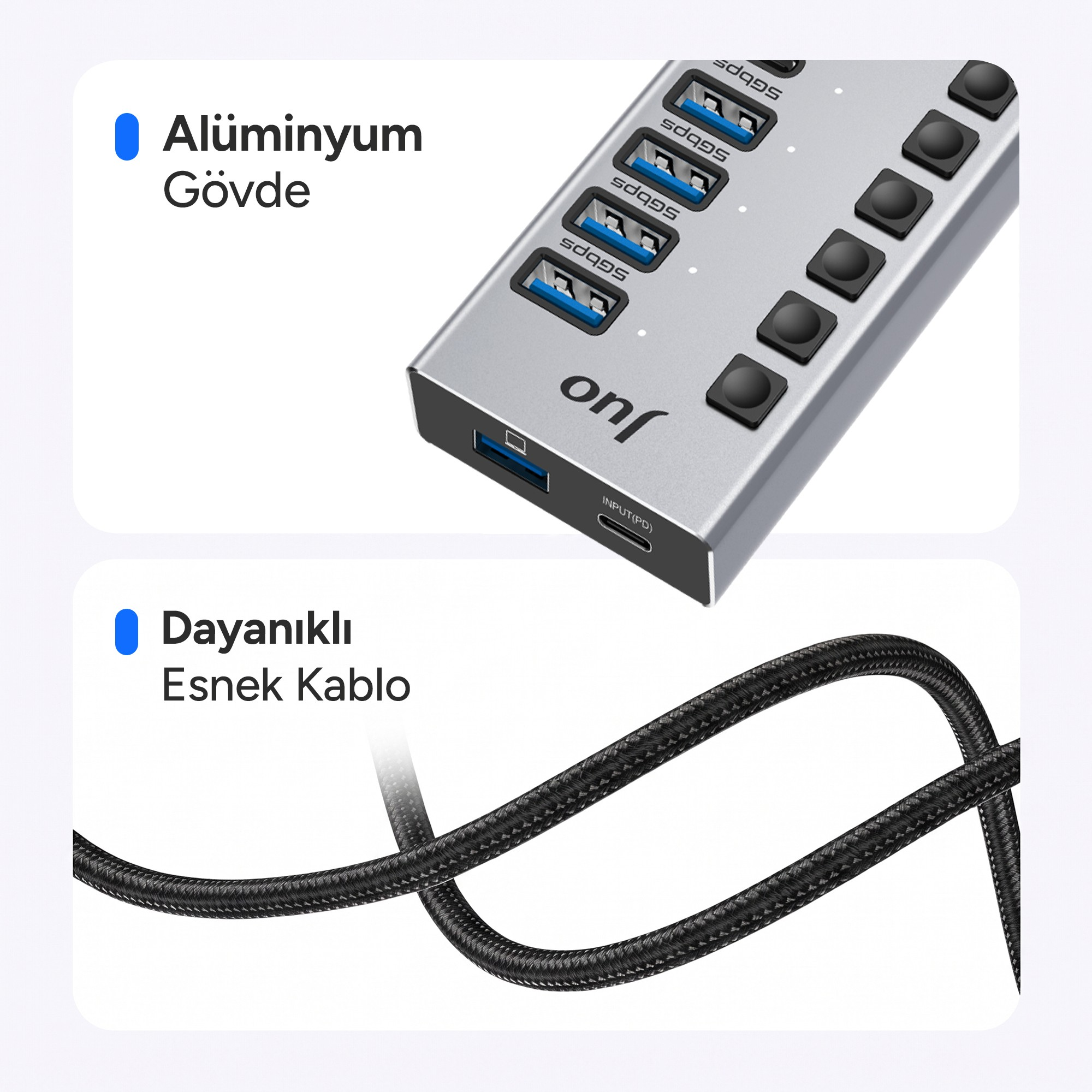 Mavi portlu gümüş renkli USB çoklayıcı ve siyah örgülü kablo.