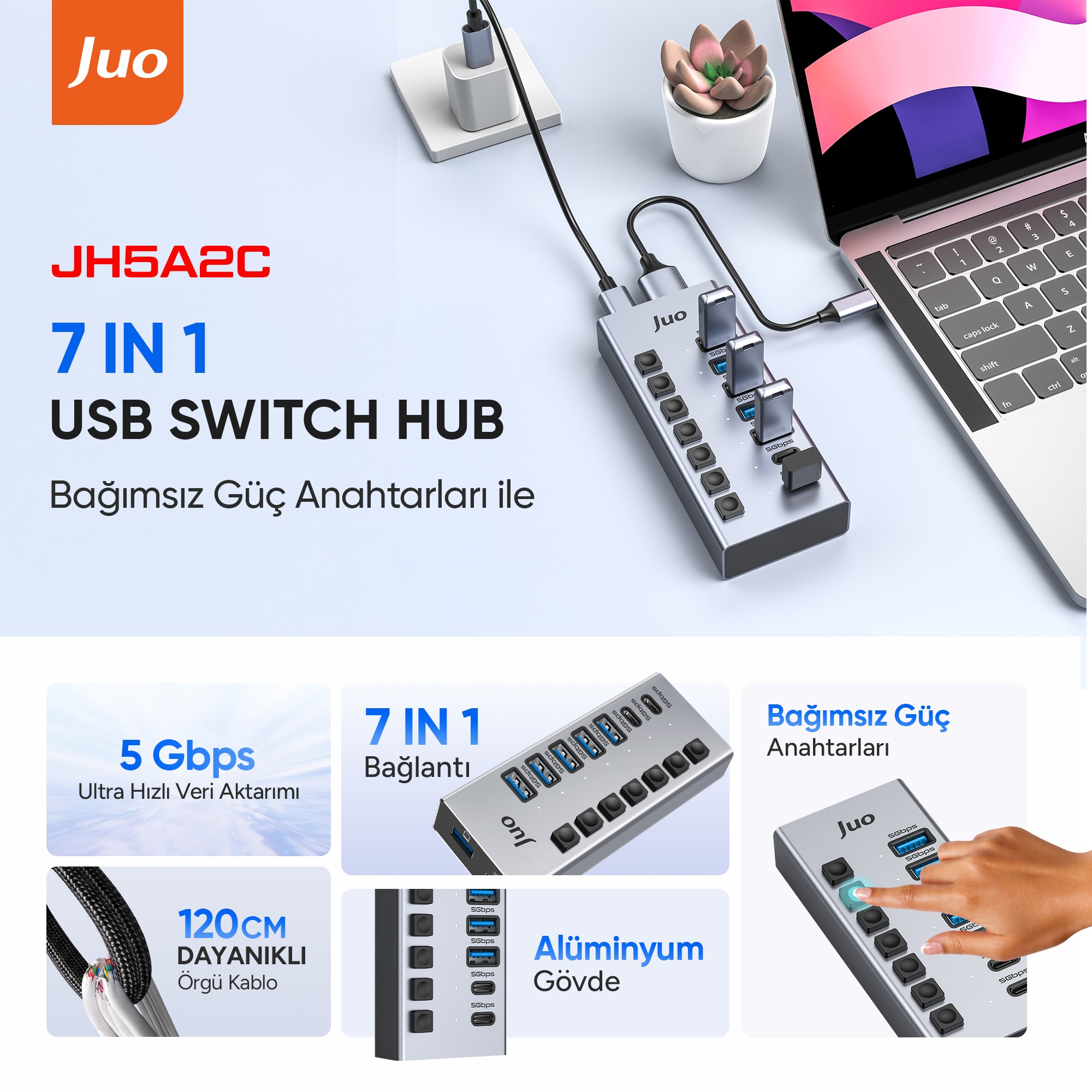 Bağımsız güç anahtarlarına sahip gümüş renkli 7'si 1 arada USB anahtar hub'ı, bir dizüstü bilgisayara bağlı.