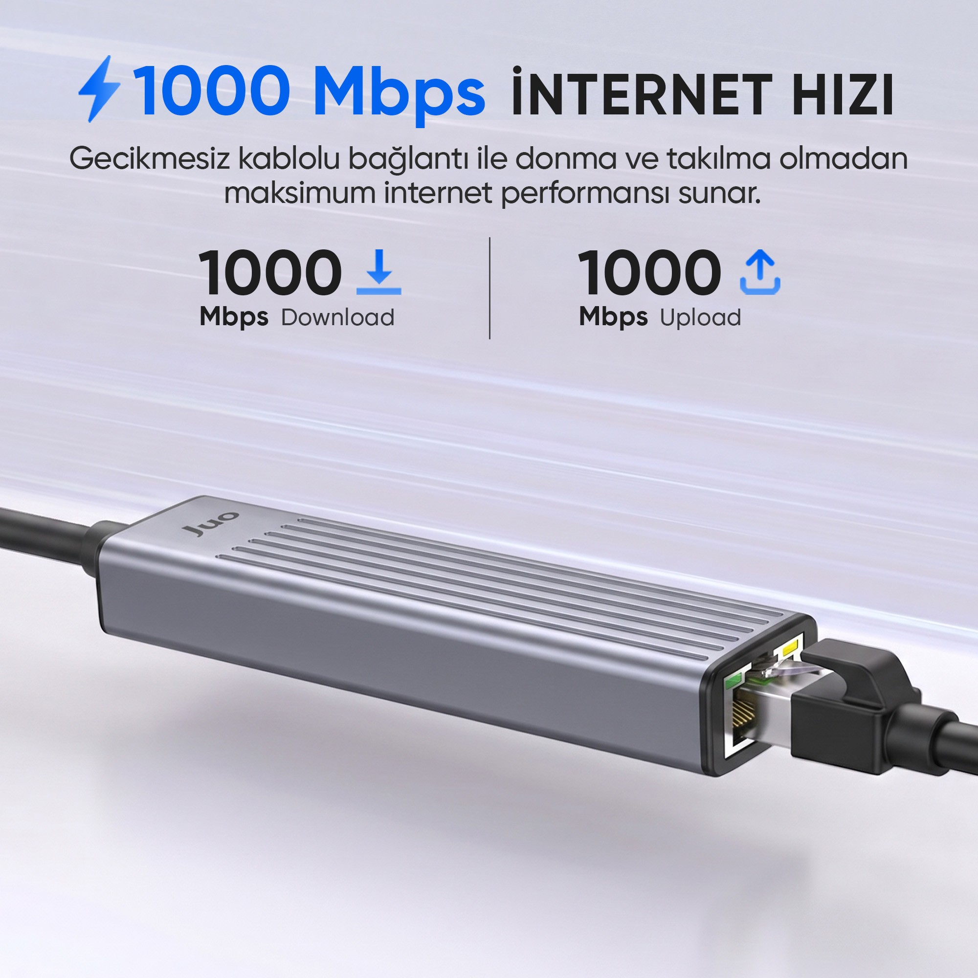 1000 Mbps indirme ve yükleme hızı gösteren gri renkli Juo ethernet adaptörü.