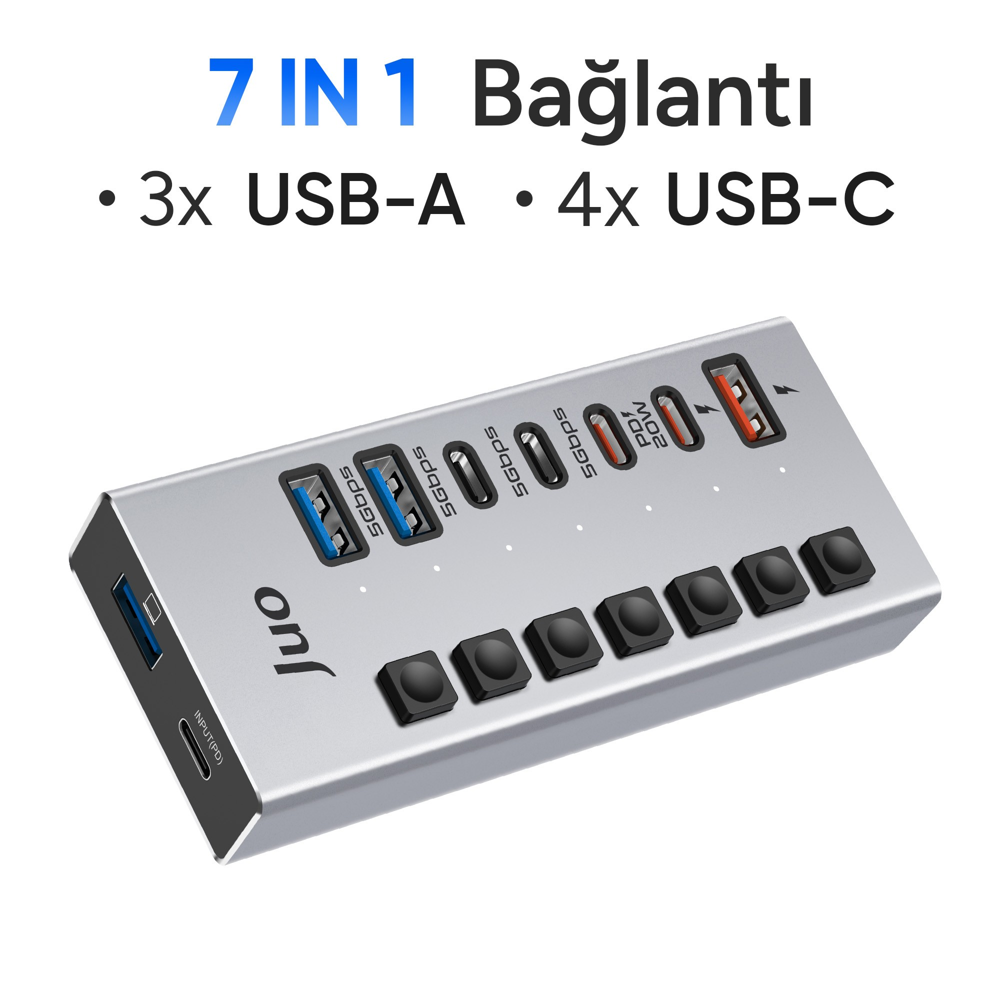 Üç USB-A ve dört USB-C bağlantı noktasına ve güç tuşlarına sahip gümüş rengi Juo 7'si 1 arada hub.