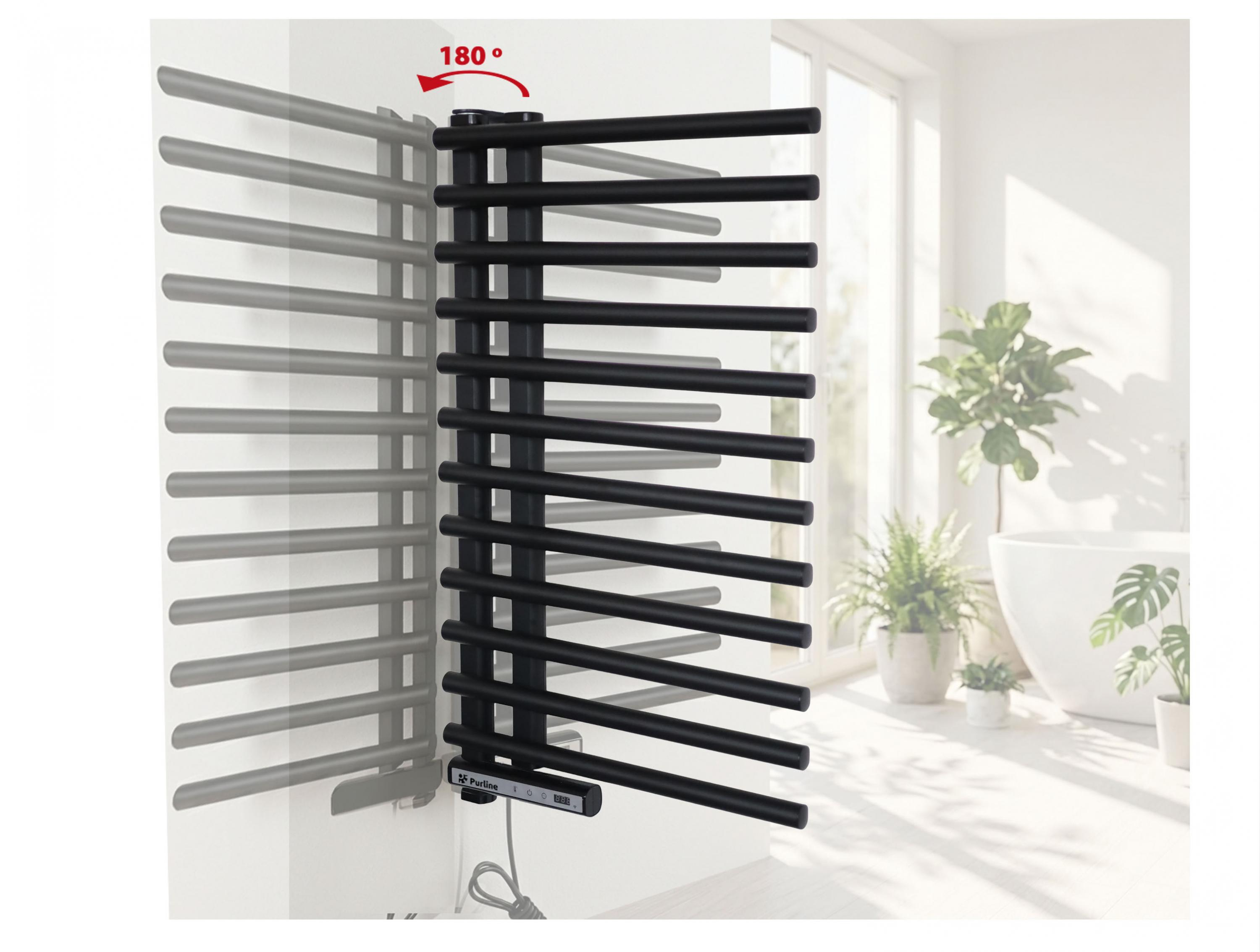Radiador toallero negro en pared blanca en baño luminoso, giratorio 180 grados.