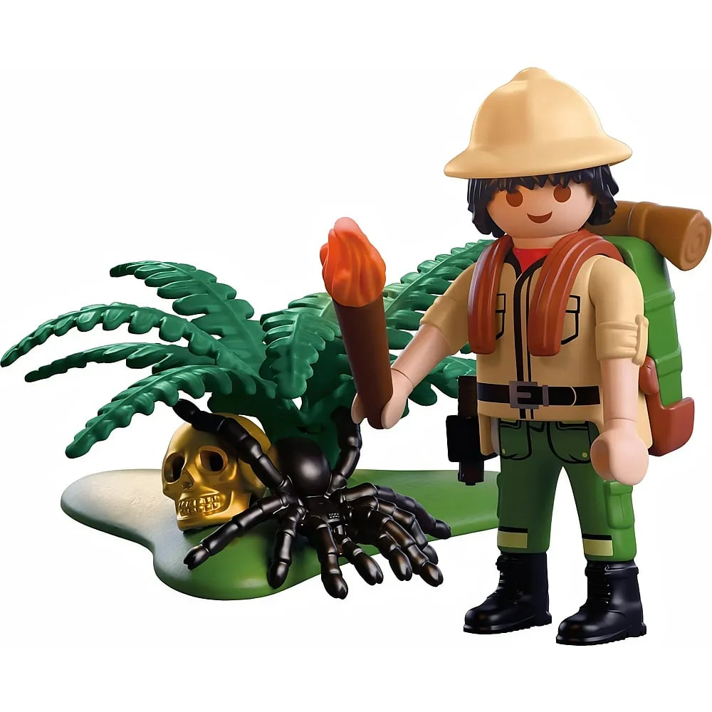 Playmobil-Abenteurer mit Hut, Fackel, Rucksack steht neben Farn, goldenem Schädel und schwarzer Spinne.