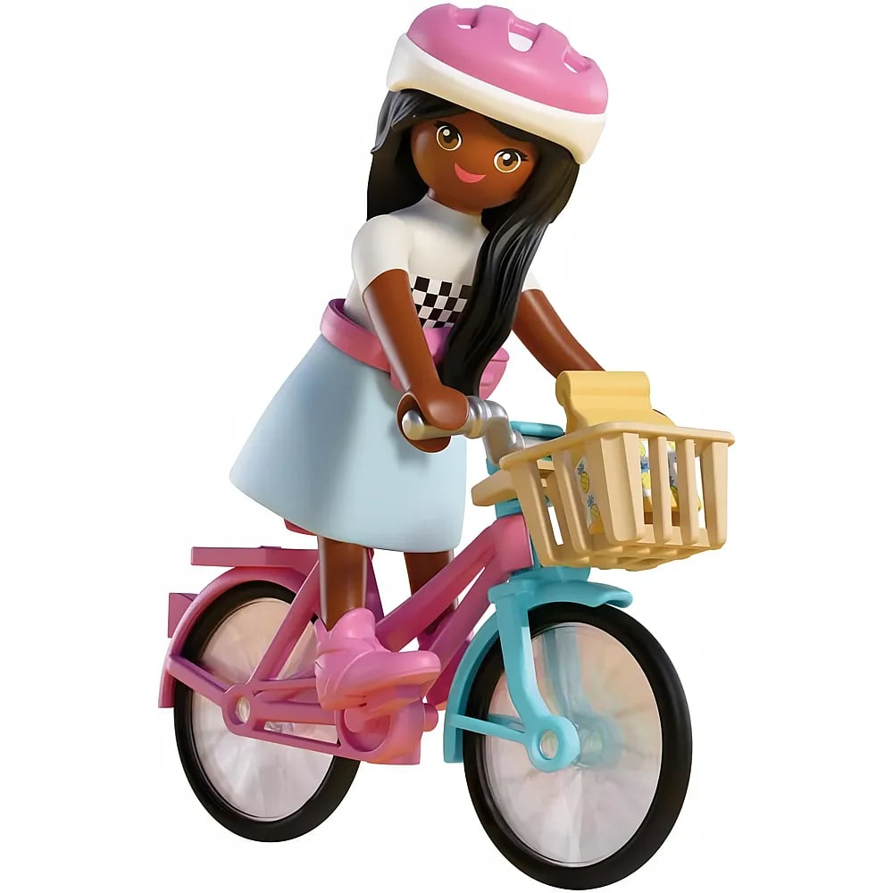 Una figura de Playmobil con casco rosa y falda azul monta en bicicleta rosa y azul con cesta delantera.