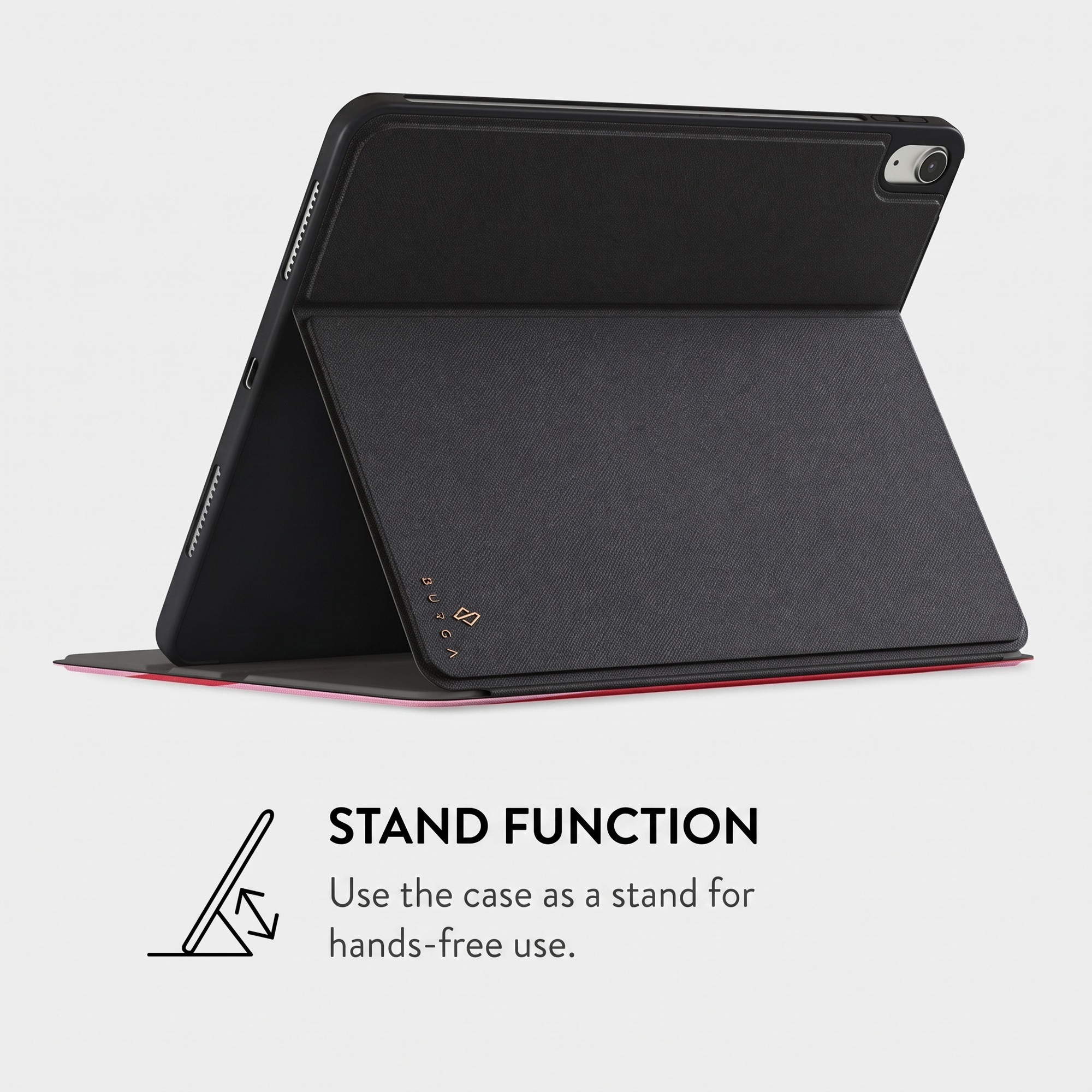 A tablet in a black protective case used as a stand, set against a grey background.