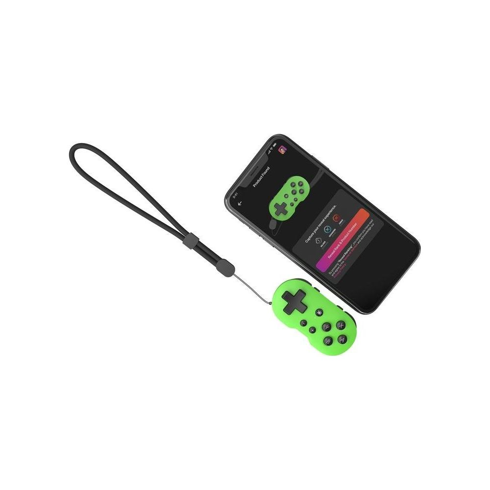 Zielony mini kontroler z czarnym paskiem na rękę obok smartfona na białym tle.