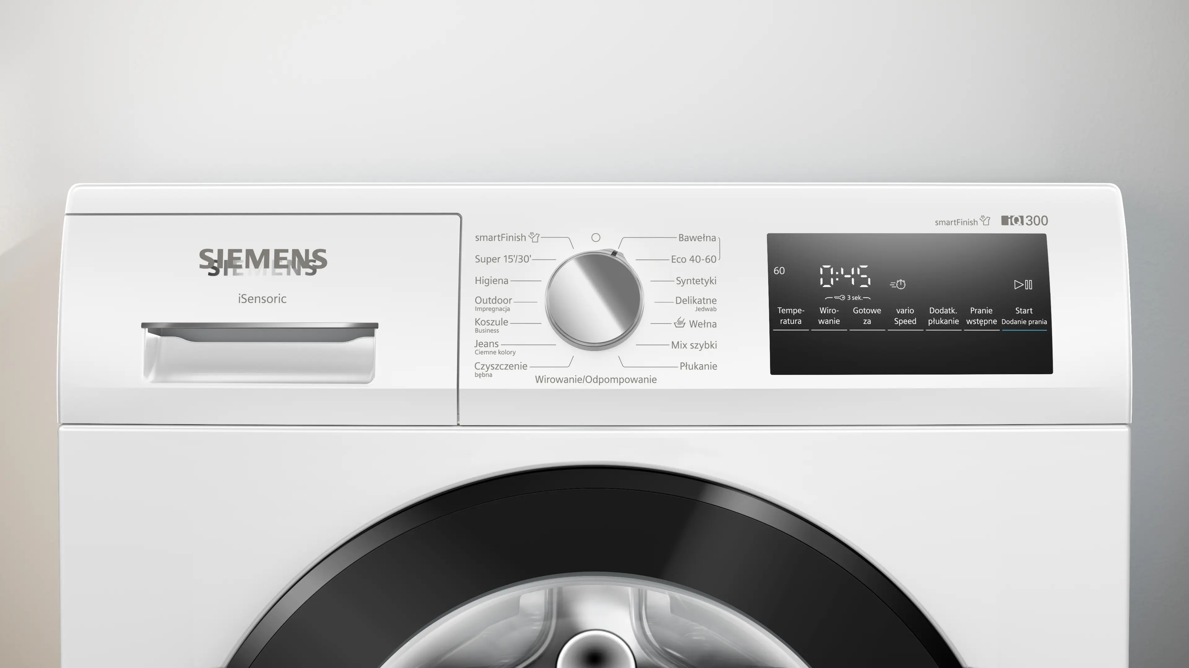 Zbliżenie panelu sterowania białej pralki Siemens z pokrętłem programów, wyświetlaczem cyfrowym i szufladą na detergenty.
