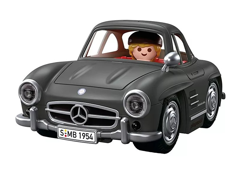 Direksiyonda küçük bir aksiyon figürü olan gri bir Playmobil klasik Mercedes-Benz araba.