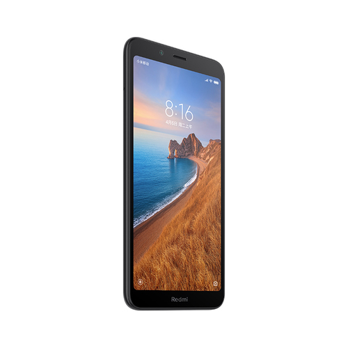 Uno smartphone nero con lo schermo che mostra un paesaggio costiero.