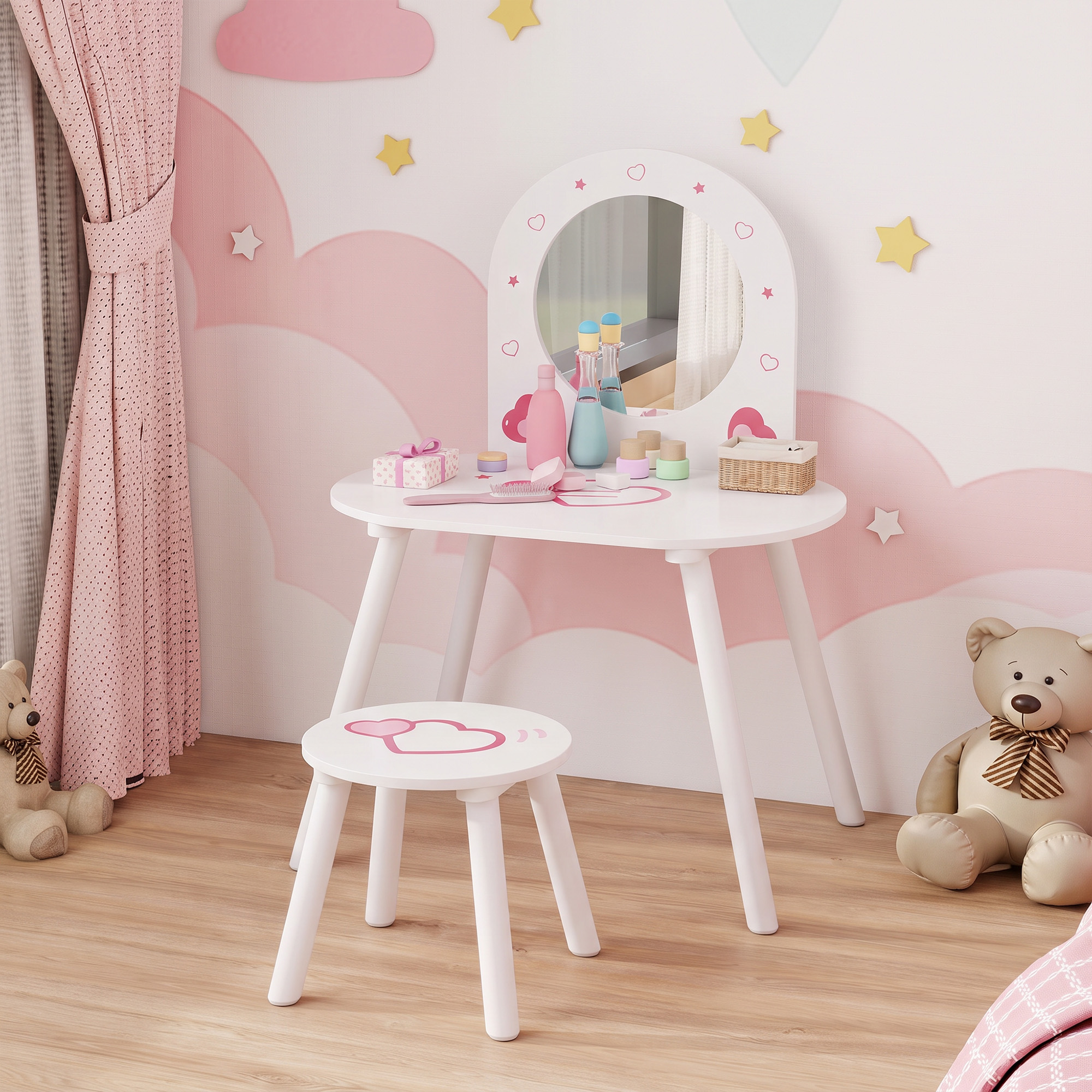 Un tocador infantil blanco con taburete, espejo y juguetes en una habitación rosa.