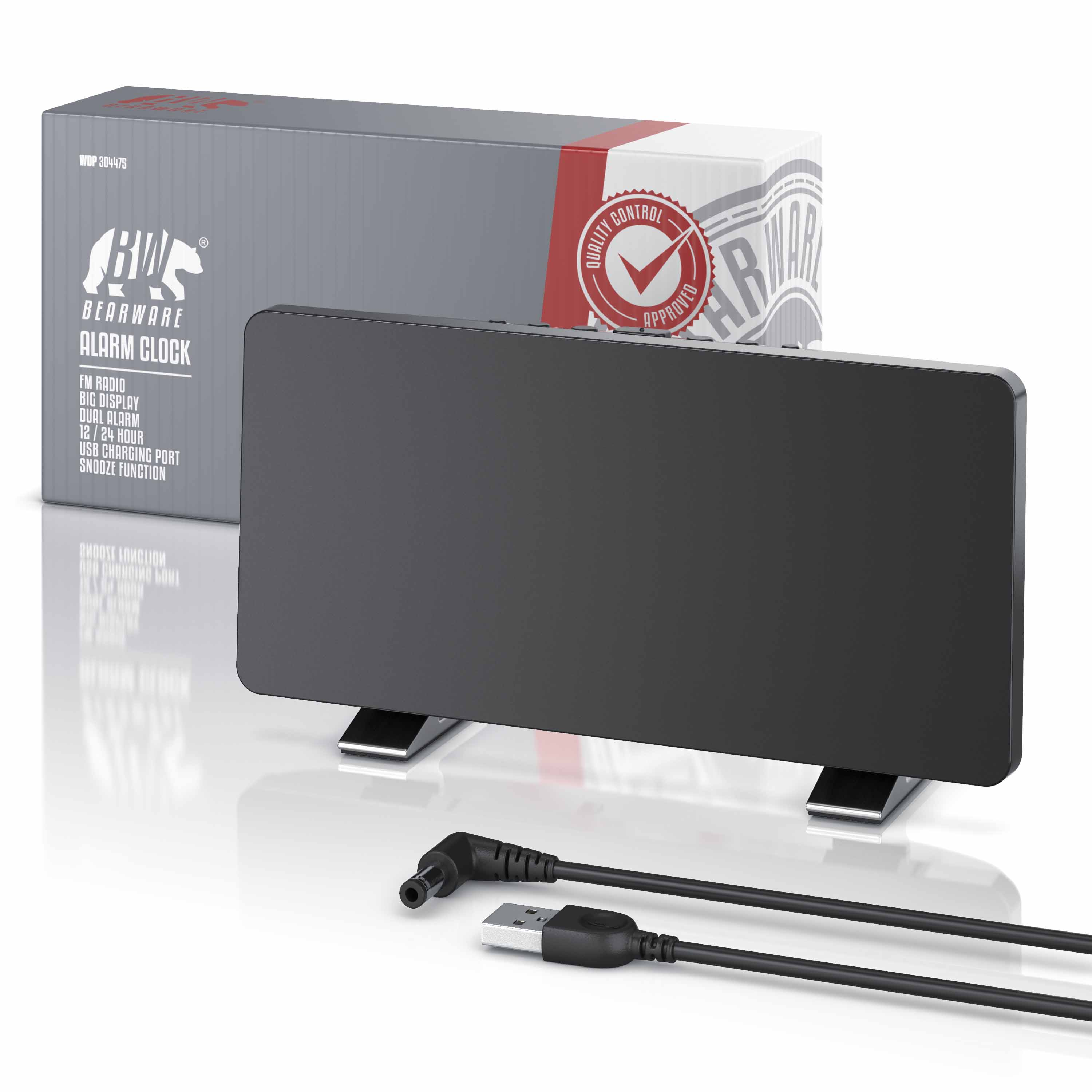 Schwarzer Wecker mit Standfüßen vor der grauen Verpackung und einem USB-Kabel im Vordergrund.