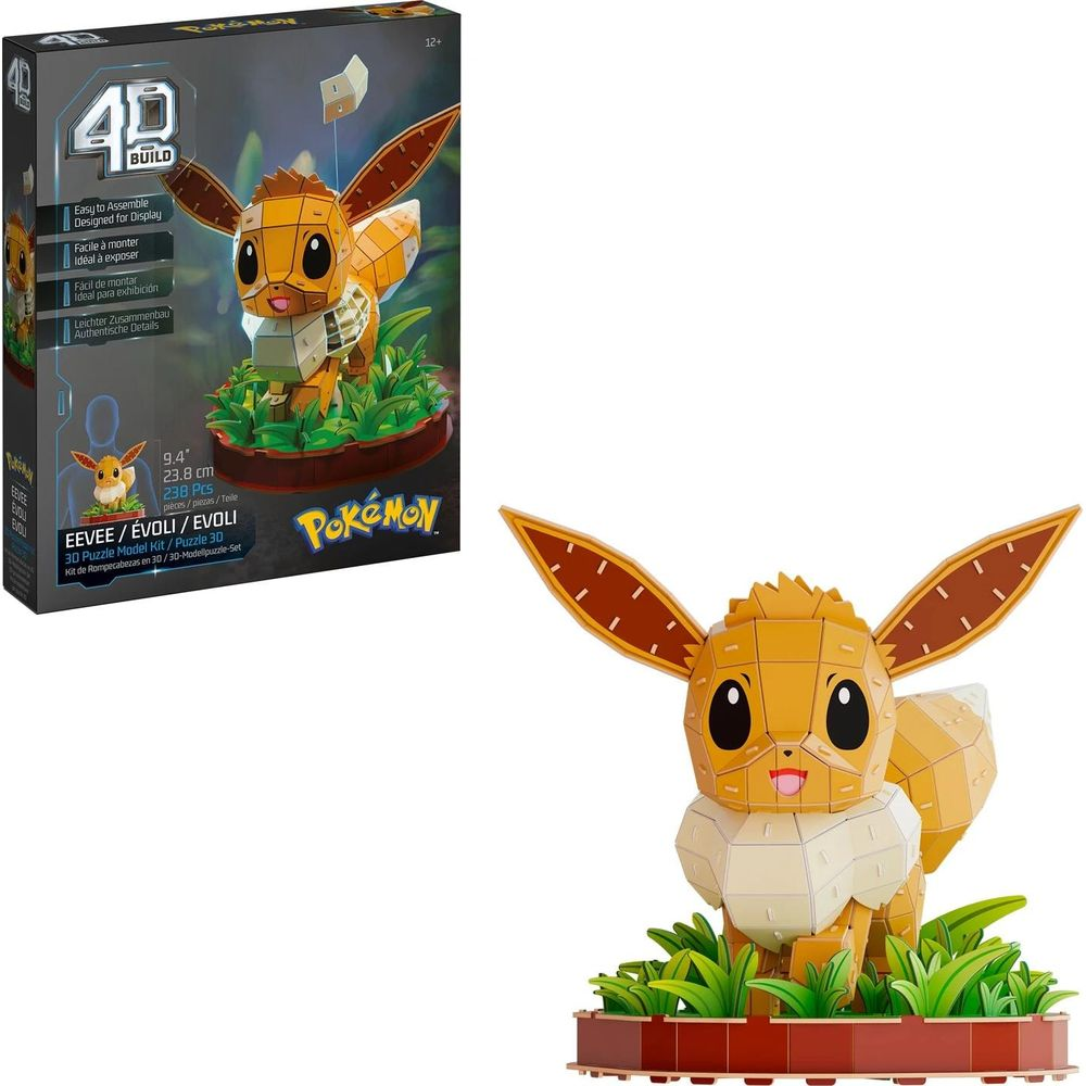 Un kit de modelo de rompecabezas 3D de Eevee de Pokémon sobre una base verde, junto a su caja.