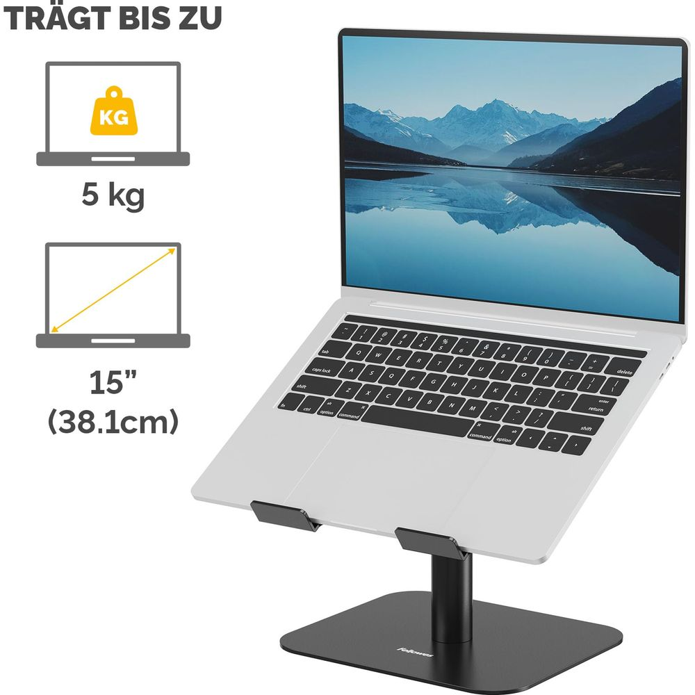Silberner Laptop auf einem schwarzen Ständer mit Bergwallpaper. Icons zeigen 5kg Tragkraft und bis zu 15 Zoll Größe.