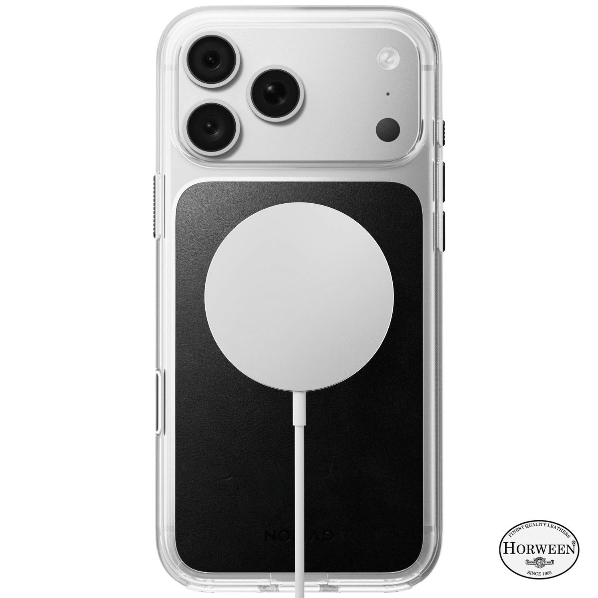 Un iPhone con funda transparente, panel trasero negro y cargador inalámabrico blanco.