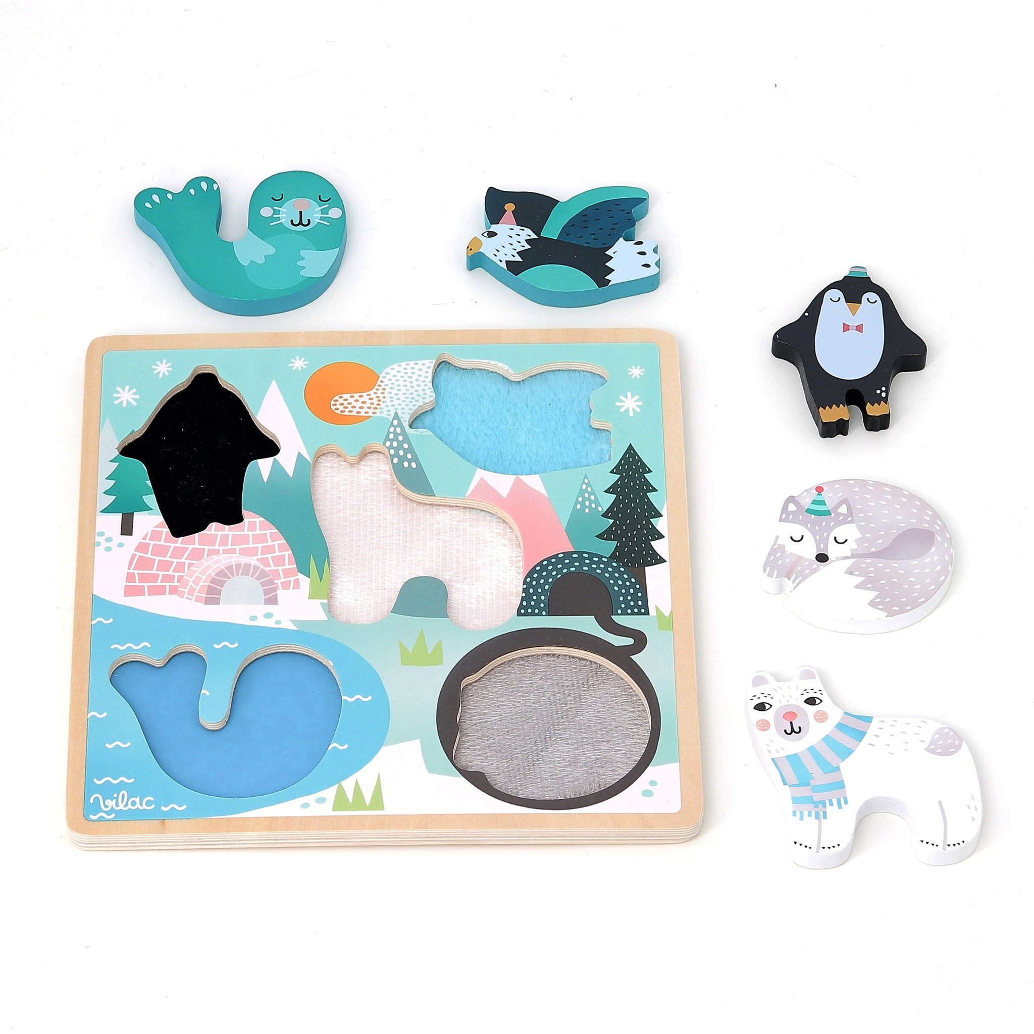 Ein hölzernes Steckspiel mit polaren Tierfiguren wie Robbe, Pinguin und Eisbär.