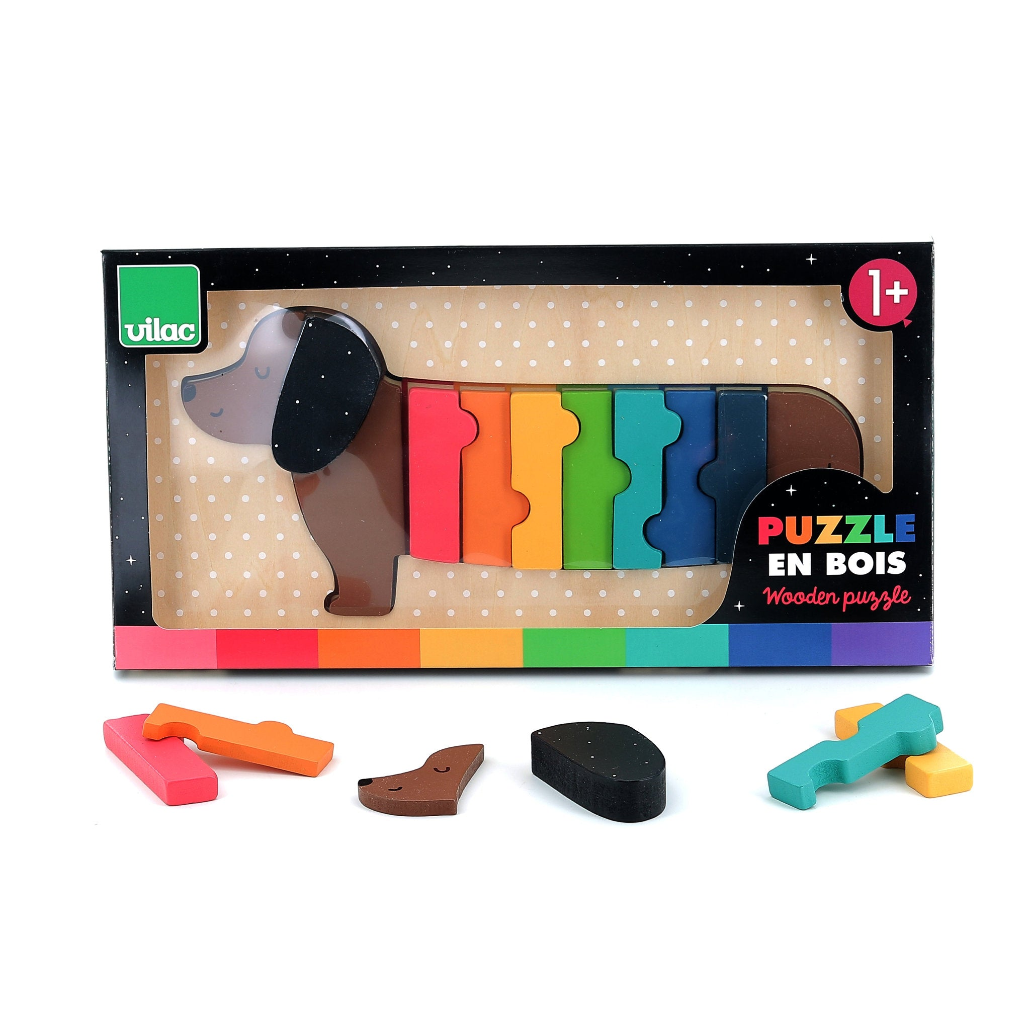 Bunte Dackel-Holzpuzzle-Verpackung mit Einzelteilen vorne auf weißem Grund.