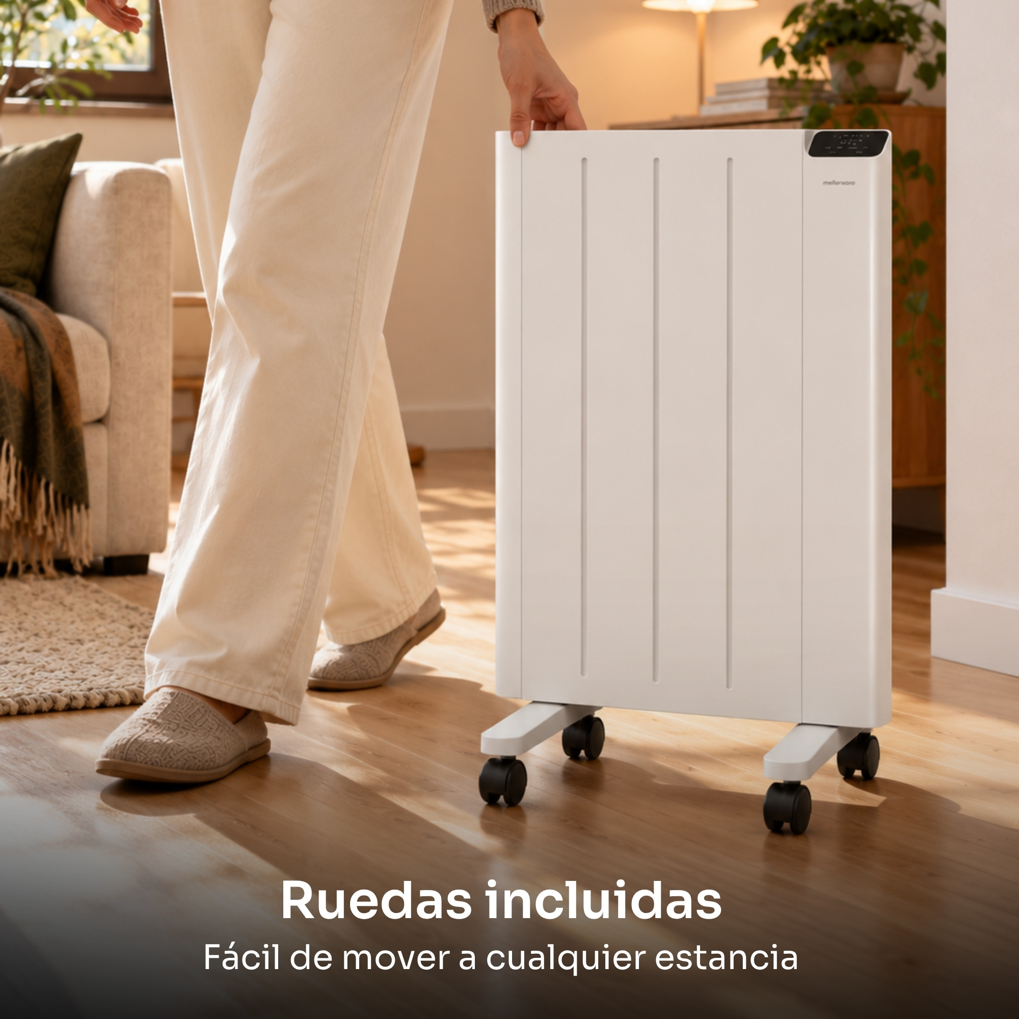 Una persona con pantalones claros y zapatillas arrastra un calefactor blanco con ruedas por un suelo de madera.
