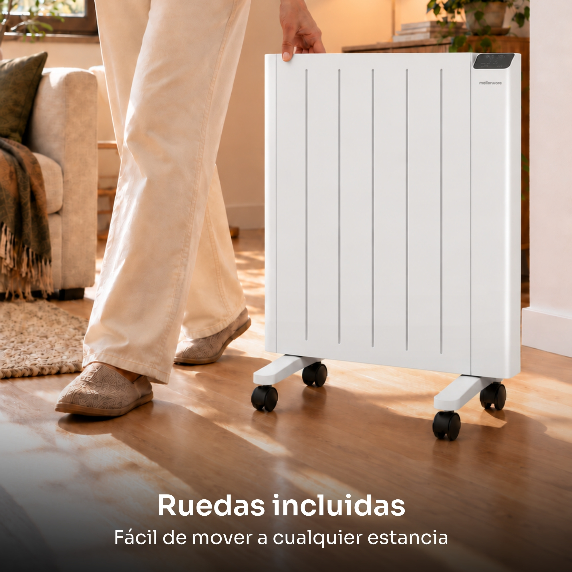 Una persona mueve un radiador blanco con ruedas por un suelo de madera en una habitación.