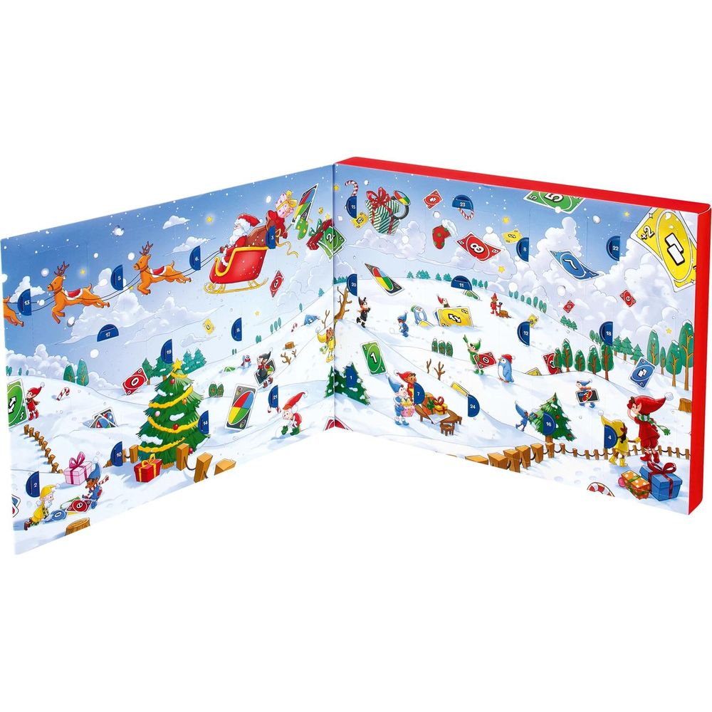 Un calendario dell'avvento aperto con paesaggio innevato, Babbo Natale, elfi e motivi di carte Uno.