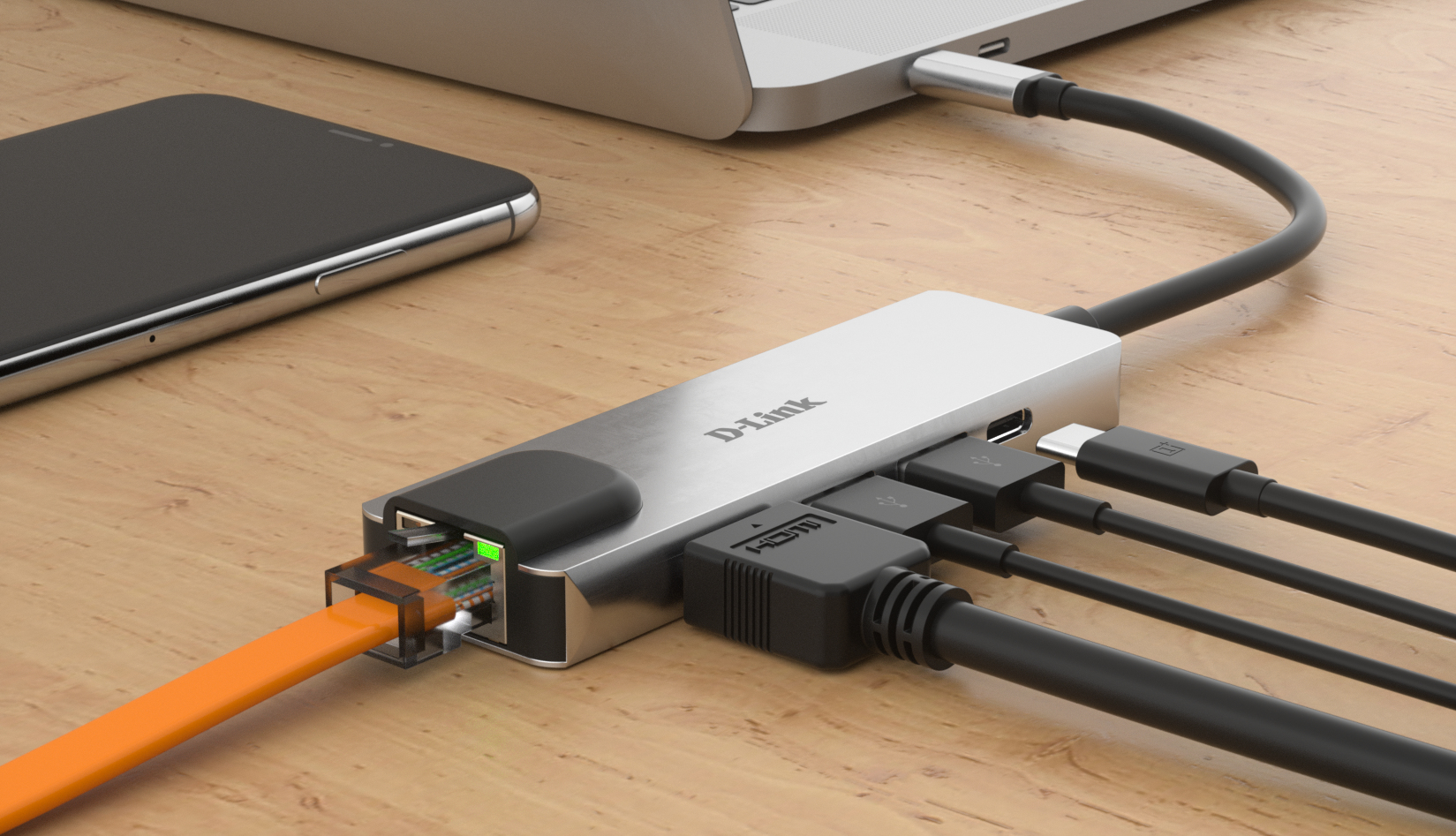 Un concentrador USB-C D-Link plateado conectado a una computadora portátil, con varios cables y un teléfono.