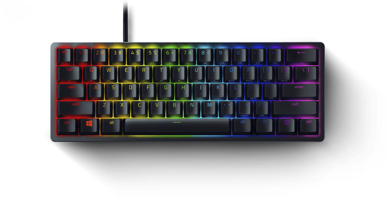 Teclado negro compacto con vibrante retroiluminación RGB sobre fondo blanco.
