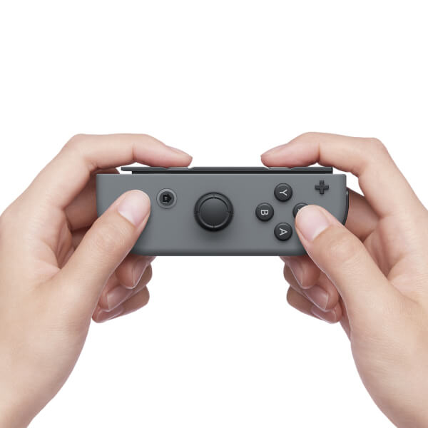 Two hands holding a gray game controller against a white background.