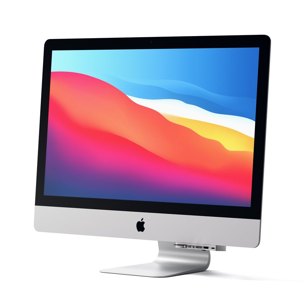 Una computadora Apple iMac con un fondo de ondas coloridas y un concentrador USB en el soporte, sobre fondo blanco.