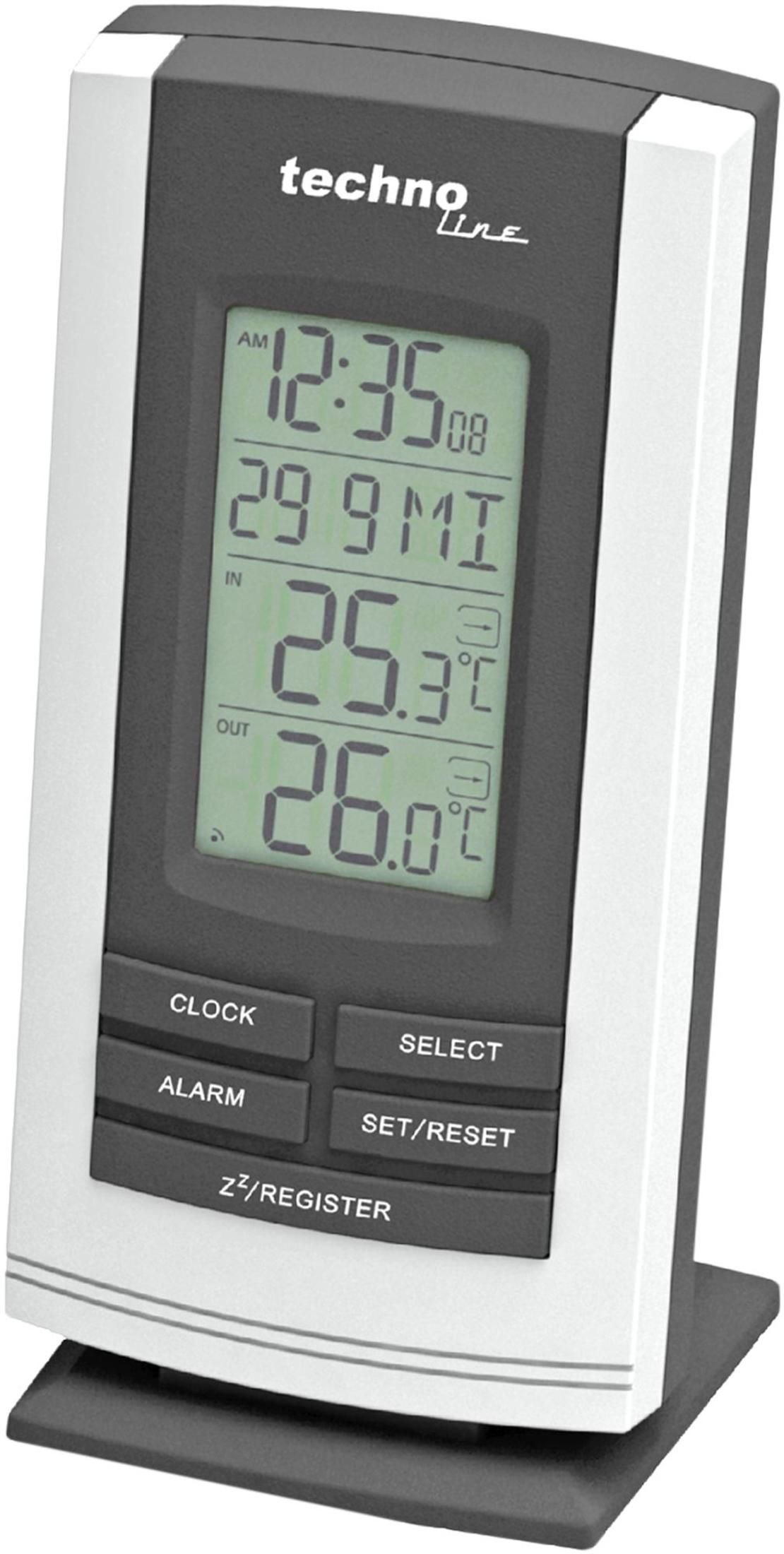Grau-weiße Techno Line Digitaluhr mit LCD-Bildschirm und Tasten auf einem Tisch.