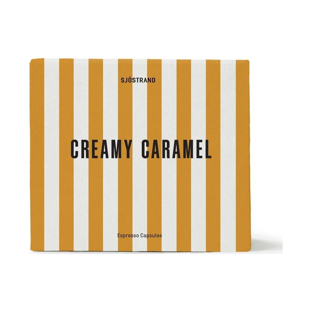 Scatola a righe bianche e gialle con etichetta Sjöstrand Creamy Caramel Espresso Capsules.