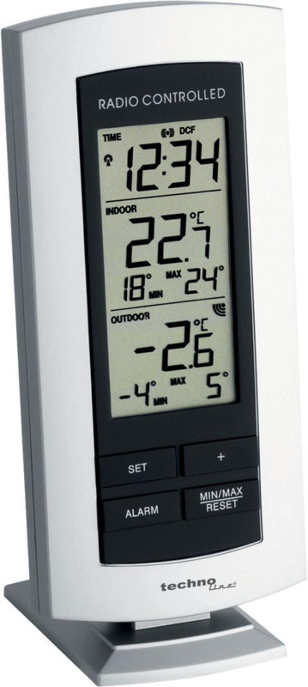 Eine weiß-schwarze digitale Wetterstation zeigt Zeit, Innen- und Außentemperatur.