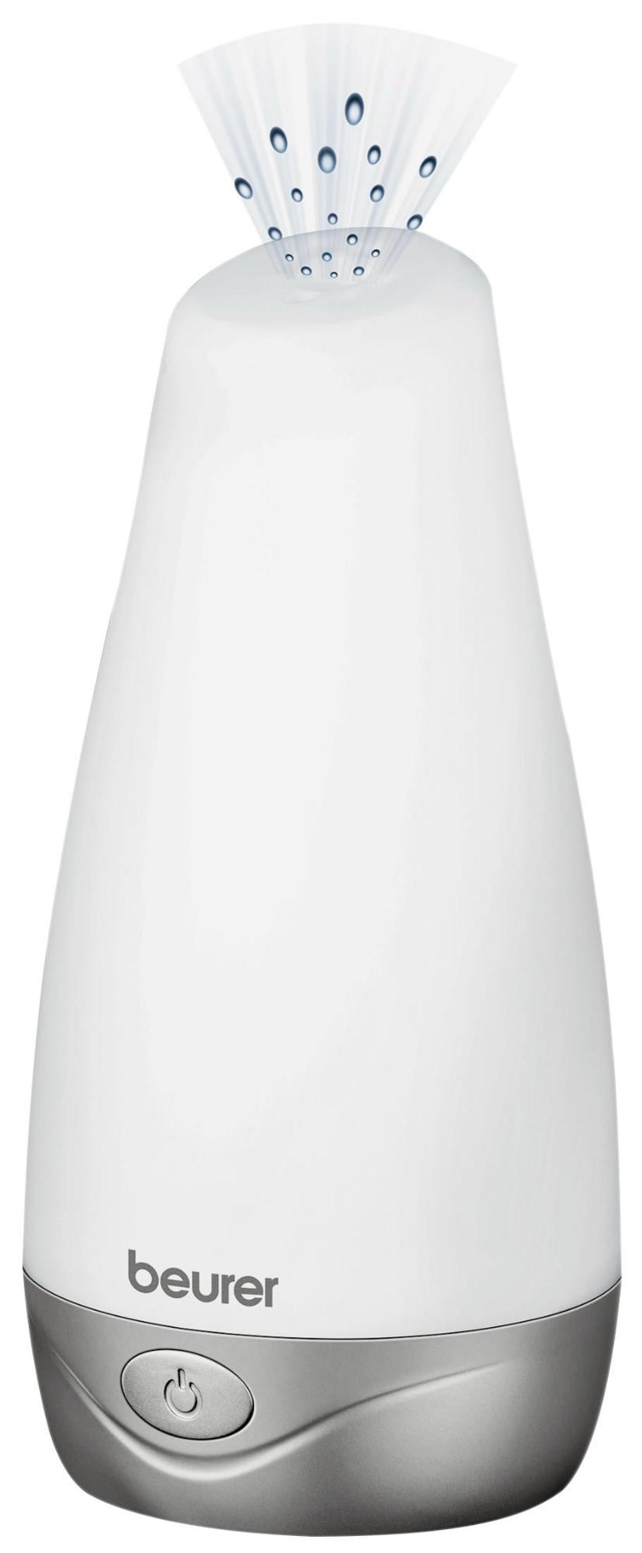 Weißer Beurer Aroma-Diffusor mit silberner Basis, der feinen Nebel und Wassertropfen ausstößt.