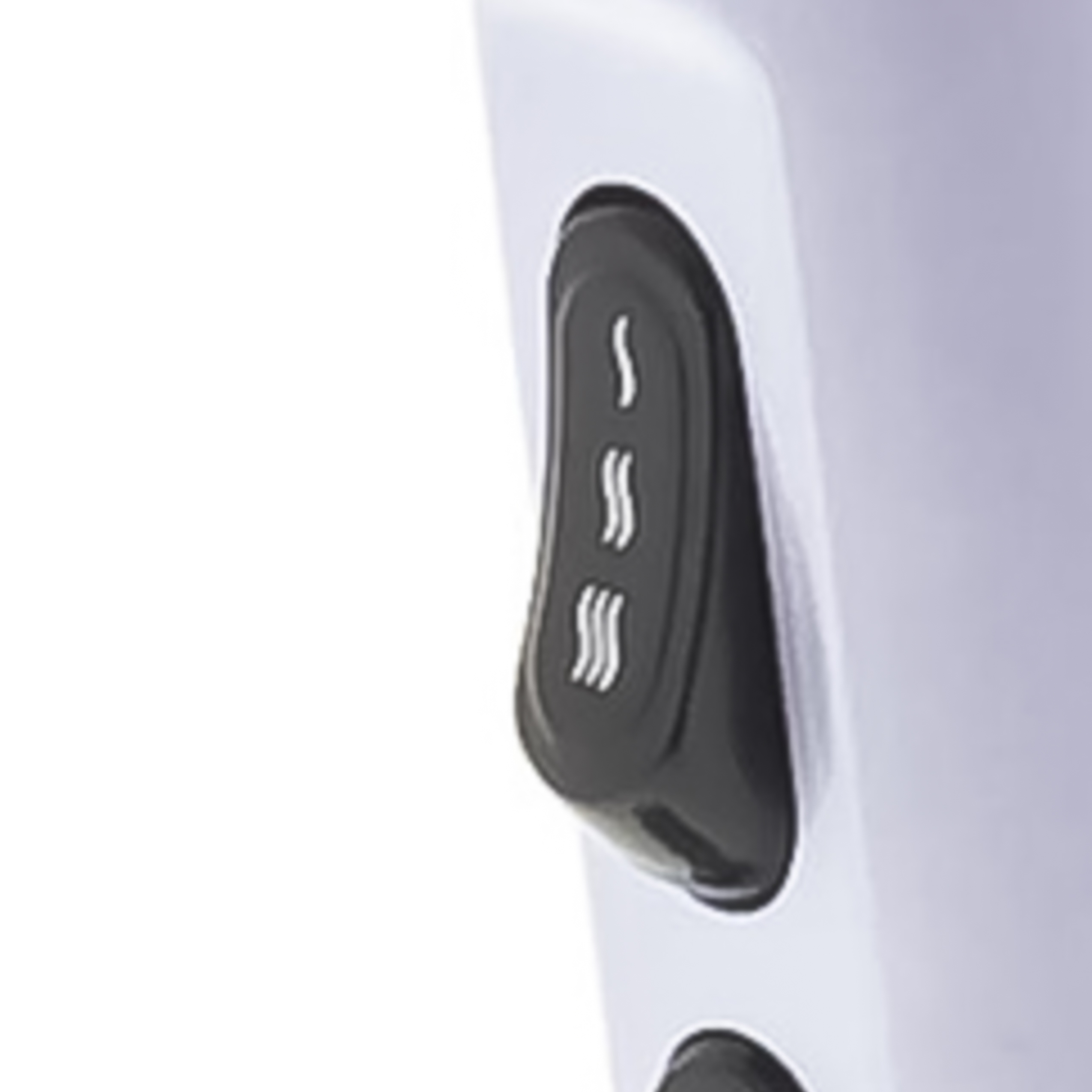 A black rocker switch with wave symbols on a white hair dryer.