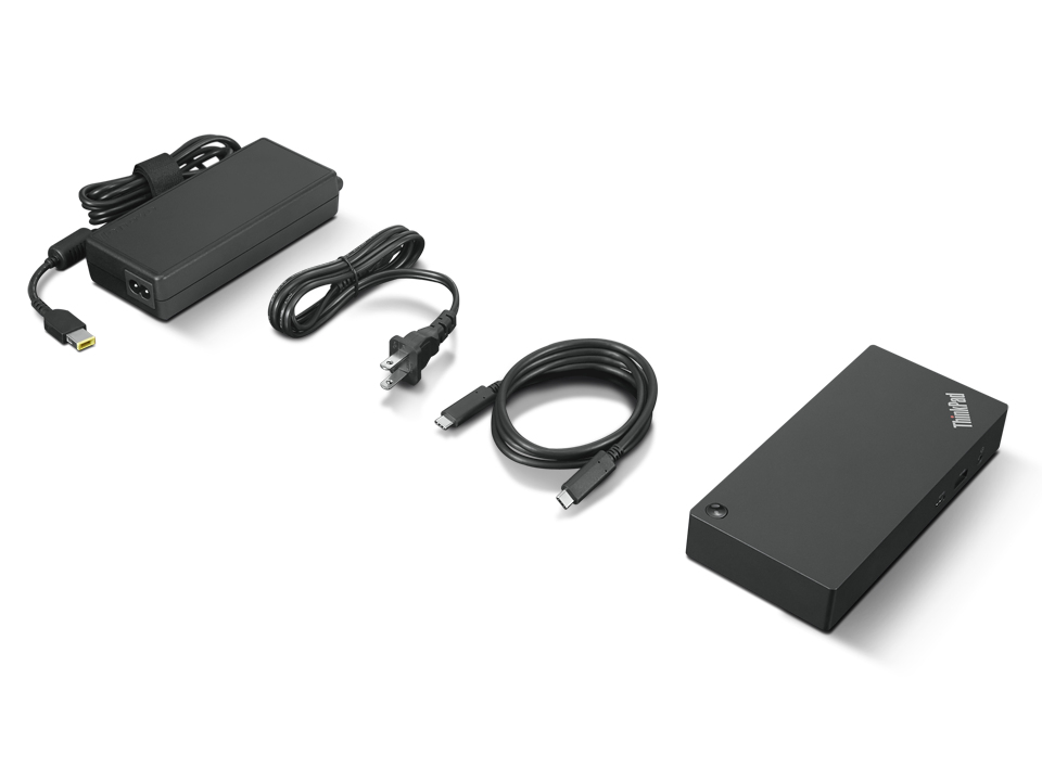 Estación de acoplamiento ThinkPad negra con adaptador de corriente, cable y cable USB-C sobre fondo blanco.
