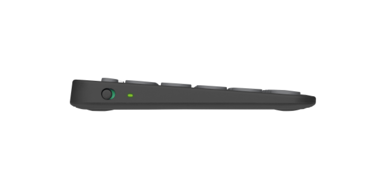 Vista laterale di una tastiera wireless grigia con pulsante di accensione rotondo e spia LED verde.